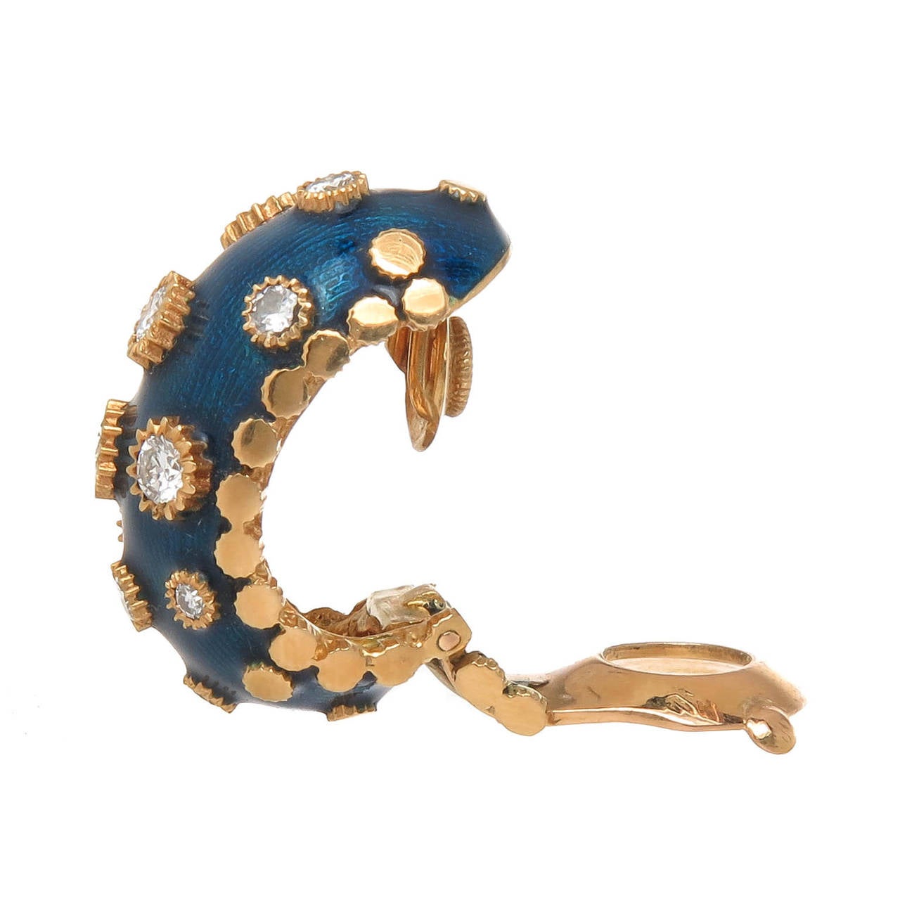 Circa 1990 Van Cleef and Arpels 18K yellow gold ear clips, finished in blue guilloche enamel and set with round brilliant cut diamonds totaling 1.30 Carat. Beautiful detailing, signed, numbered and having French hallmarks.  A post can be added to