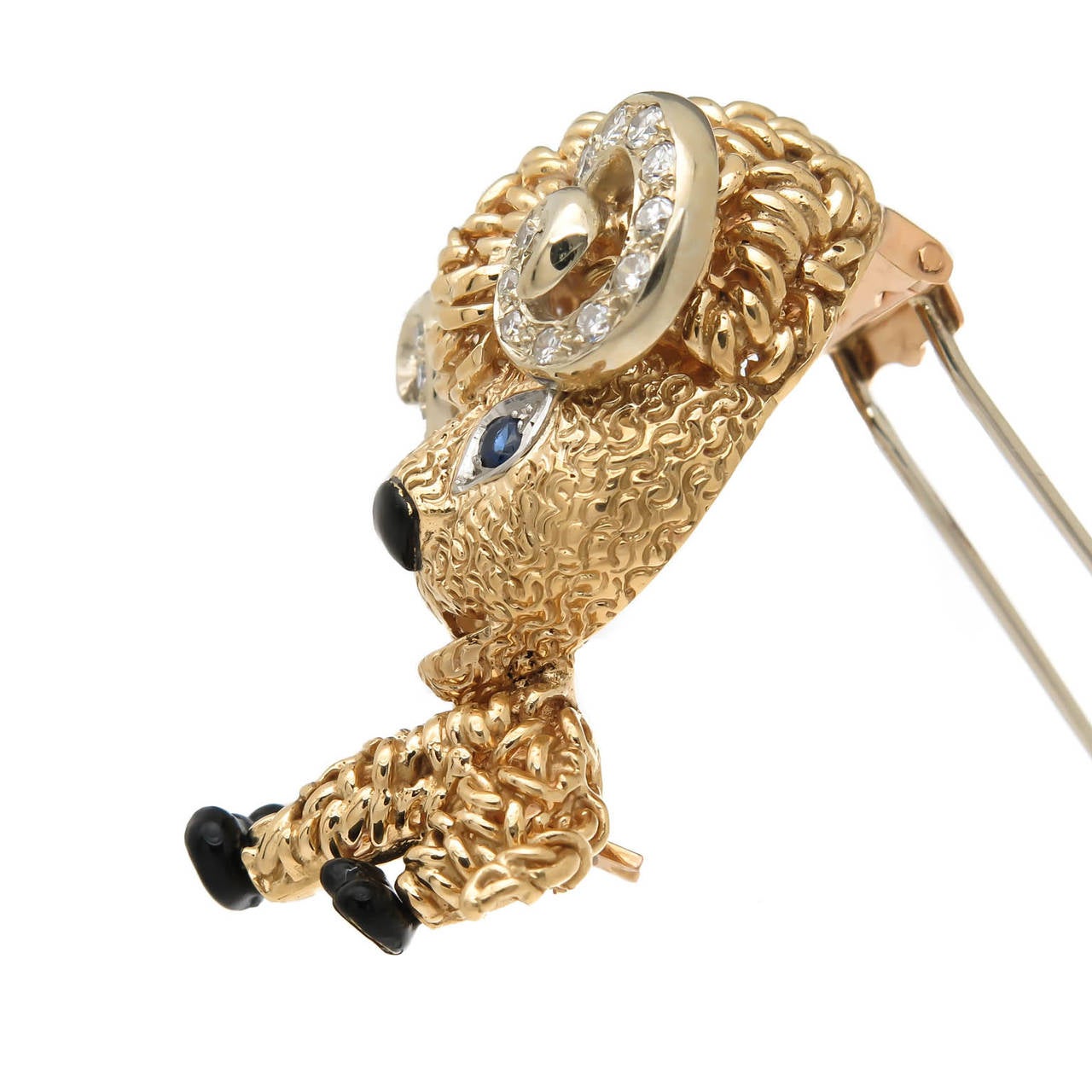 Circa 1980 Van Cleef and Arpels 18K yellow gold ram brooch, very whimsical young ram, set with diamonds and sapphires and further accented in black enamel. Having a double pin-clip back, signed, numbered and having French hallmarks.