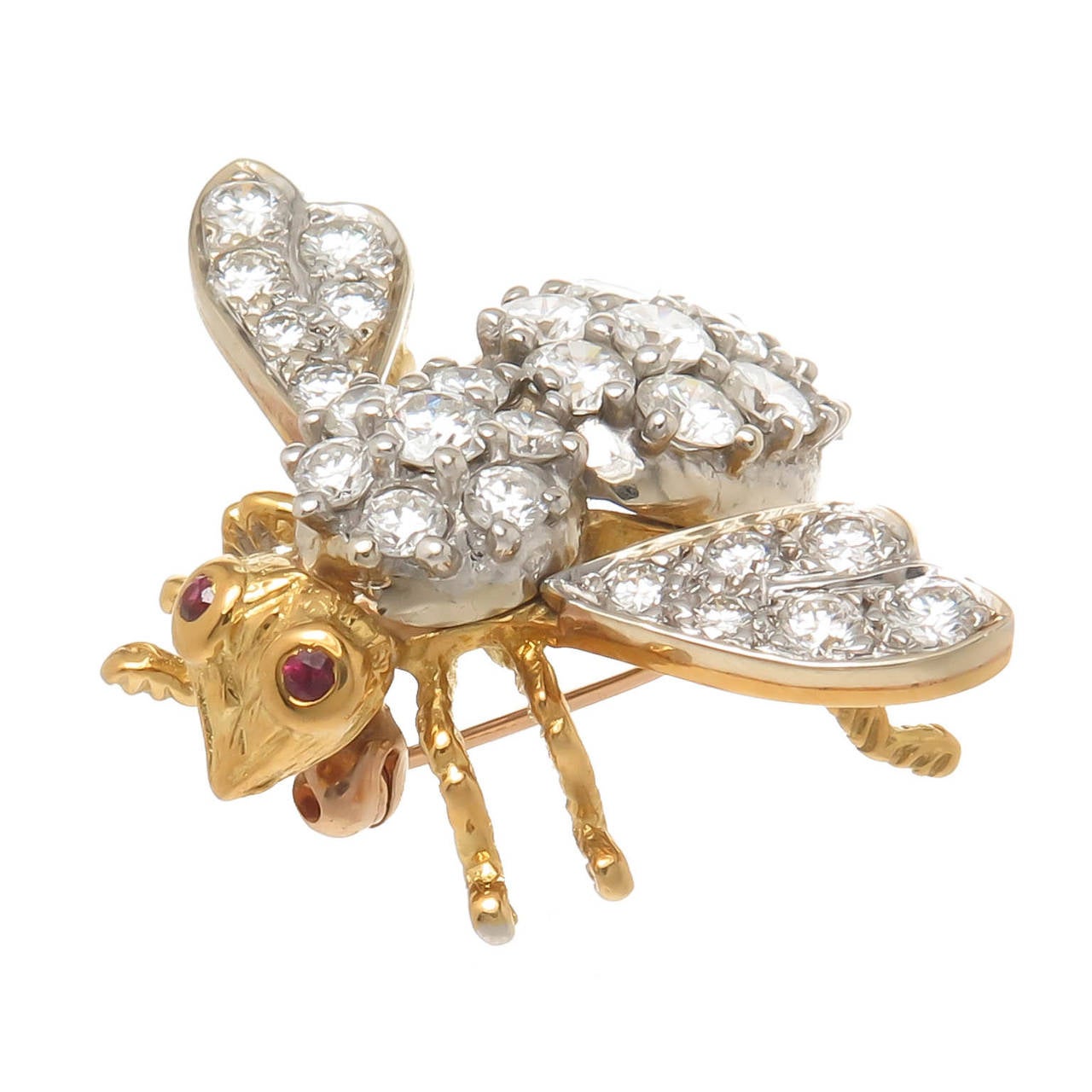 Circa 1970s 18K yellow gold and diamond set bee brooch by Herbert Rosenthal. Set with approximately 2 carats of round brilliant cut diamonds that are F-G in color and VVs in clarity. Nicely detailed and having ruby eyes.