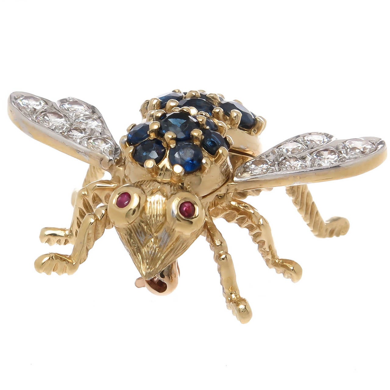 Circa 1970s Herbert Rosenthal bee brooch. 18K yellow gold and set with round brilliant cut diamonds totaling .70 carat and grading as F-G in color and VVS in clarity. Further set with fine color blue sapphires and having ruby eyes.