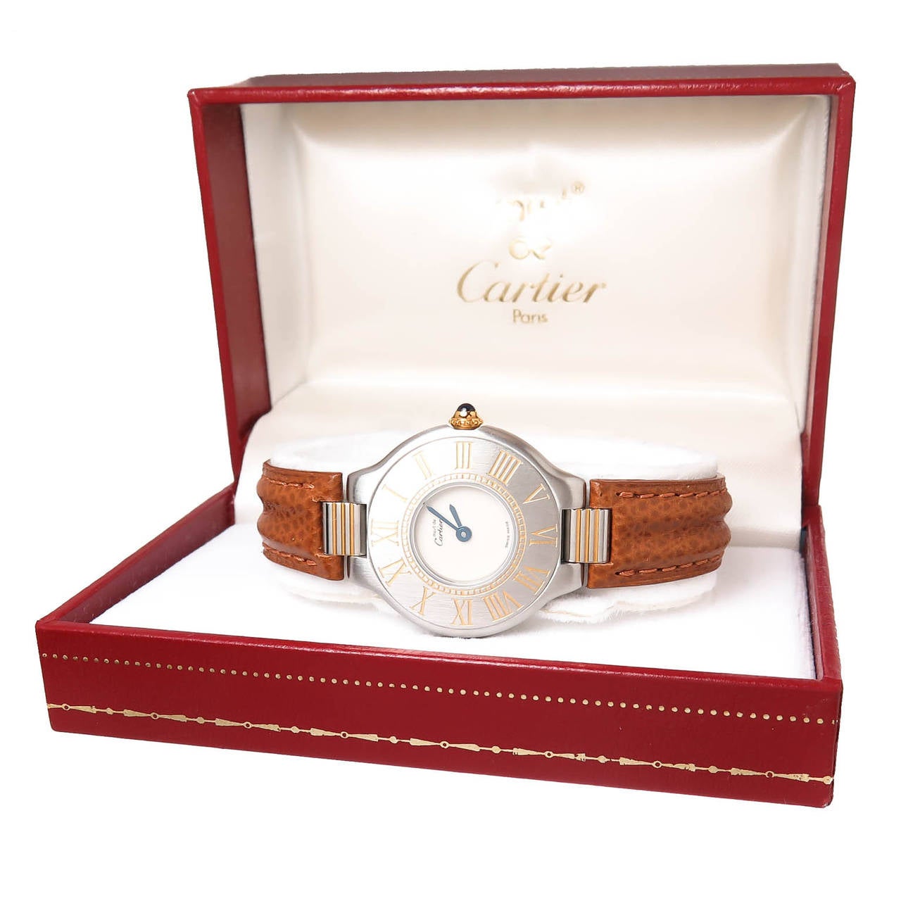 Circa 1990 Cartier Must De Cartier 21 Stainless Steel with Gold Accents Ladies Wrist Watch. 28 M.M. Water Resistant Case, Quartz Movement, Sapphire set Crown.New Brown Leather Cartier strap with Fold Over Deployment Clasp. Original Cartier