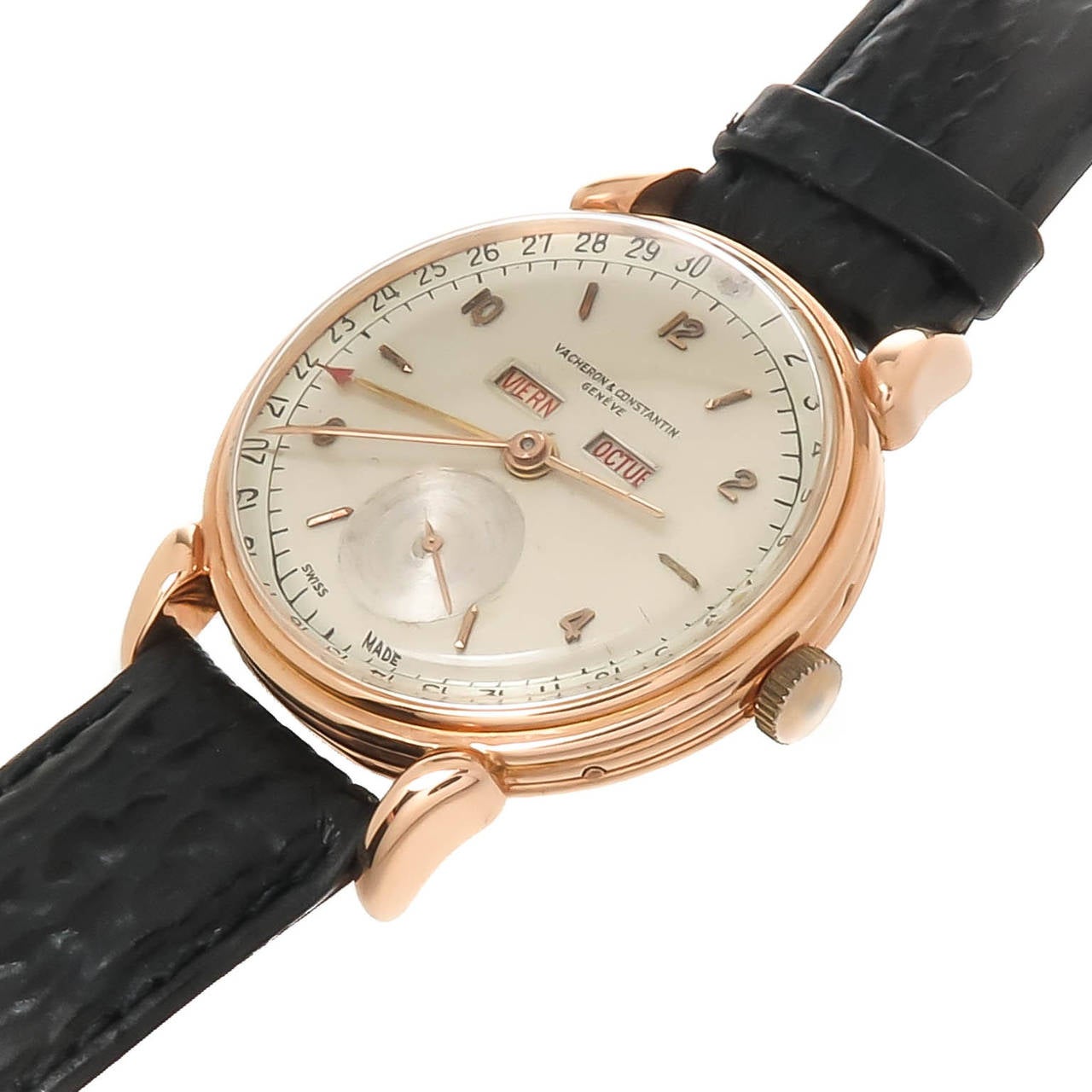 Circa 1950s Triple Calendar  Wrist watch by Vacheron & Constantin. Two Piece 18K Rose Gold 35 M.M case with Tear Drop Lugs. Caliber V495 17Jewel Manual Wind Movement. Original 2 tone Silvered Dial with raised Rose Gold Markers and Rose Gold Hands.