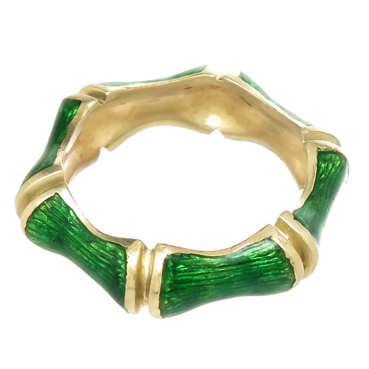 Circa 1970s Tiffany & Co. 18K yellow gold and green guilloche enamel bamboo form band ring measuring 1/4 inch wide. Finger size = 7 3/4.