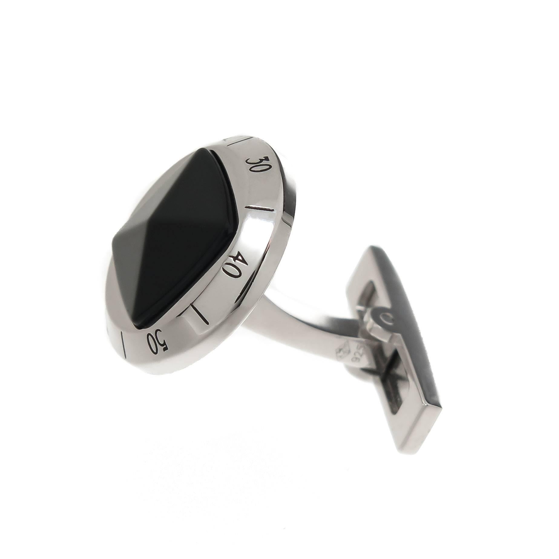 Circa 2010 Cartier Pasha De Cartier Sterling Silver and Onyx Cuff-links. Measuring 5/8 inch in diameter and having a 4 sided pyramid cut Black Onyx. Signed and numbered and in the original Cartier presentation box.
