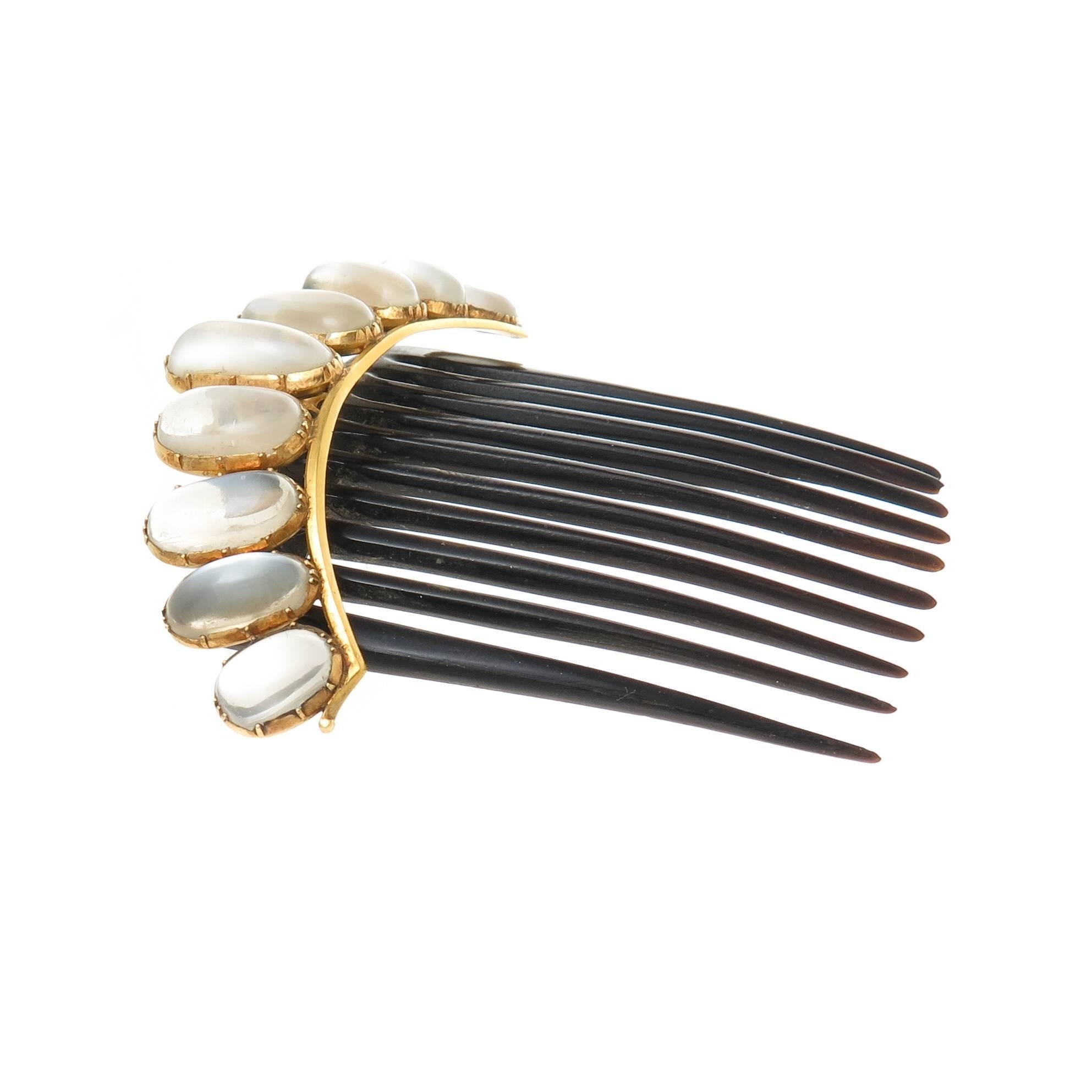 Circa 1890s Yellow Gold and Moon Stone Hair Comb, an outstanding  example of Victorian Hair ornamentation, measuring 3 inch across and set with Very fine color moonstones measuring 11 X 7 MM to 17 X 7 MM. There is a hinge attachment to the Tortoise