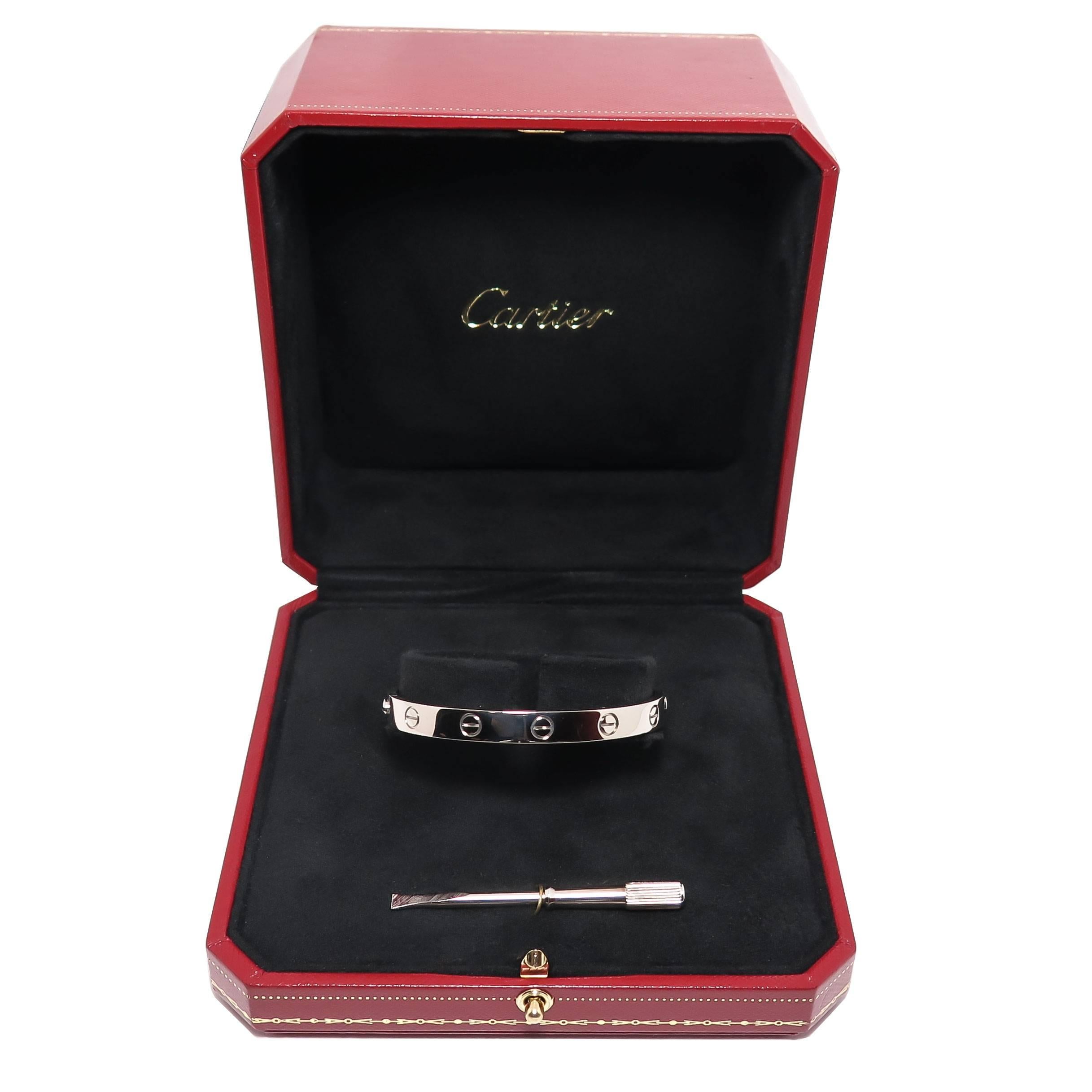 Circa 1990s Cartier 18K White Gold Classic Love Bracelet. Size 16 and measuring 6 MM wide. Signed, numbered and comes in original Presentation box with screw driver.