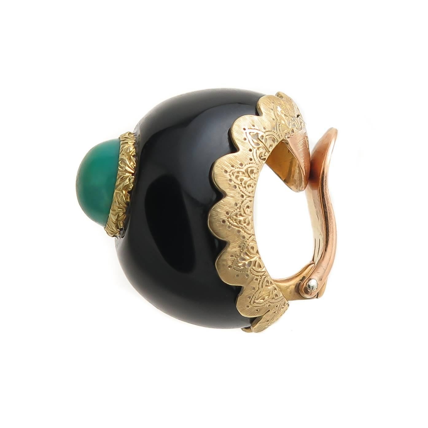 Circa 1970s Buccellati 18K Yellow Gold Earrings, measuring 3/4 inch in length and 1/2 inch wide, and set with Black onyx and a dark Green Turquoise, beautifully detailed with hand engraving work throughout. Having clip backs to which a post can be