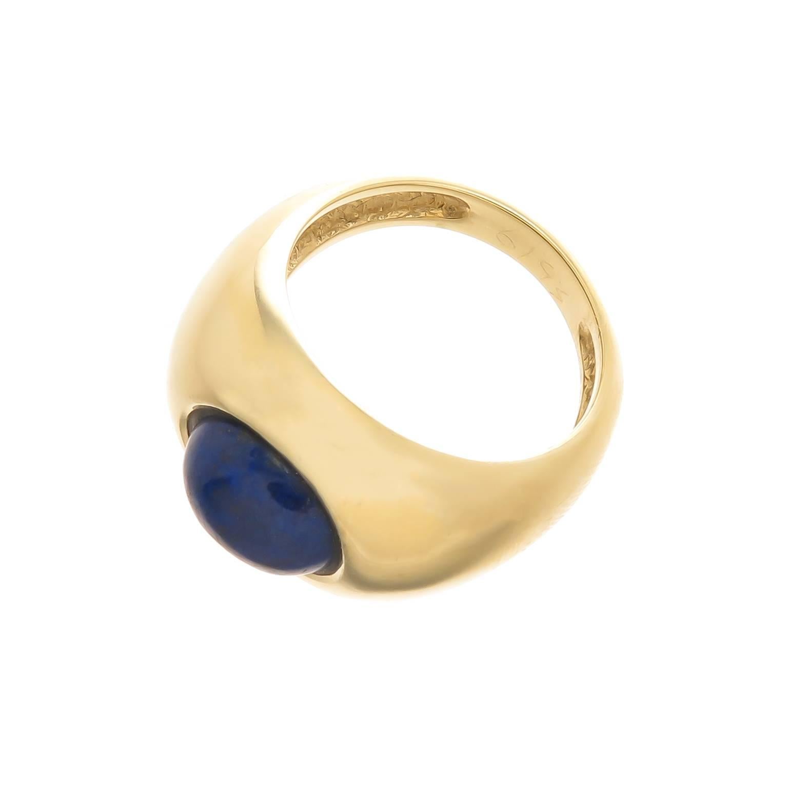 Circa 1980s simple and elegant Tiffany & Co. 18K yellow Gold and Lapis Lazuli Ring, measuring 3/4 inch across the top and set with a fine color Lapis measuring 10 X 8 MM. Finger size = 6 1/2