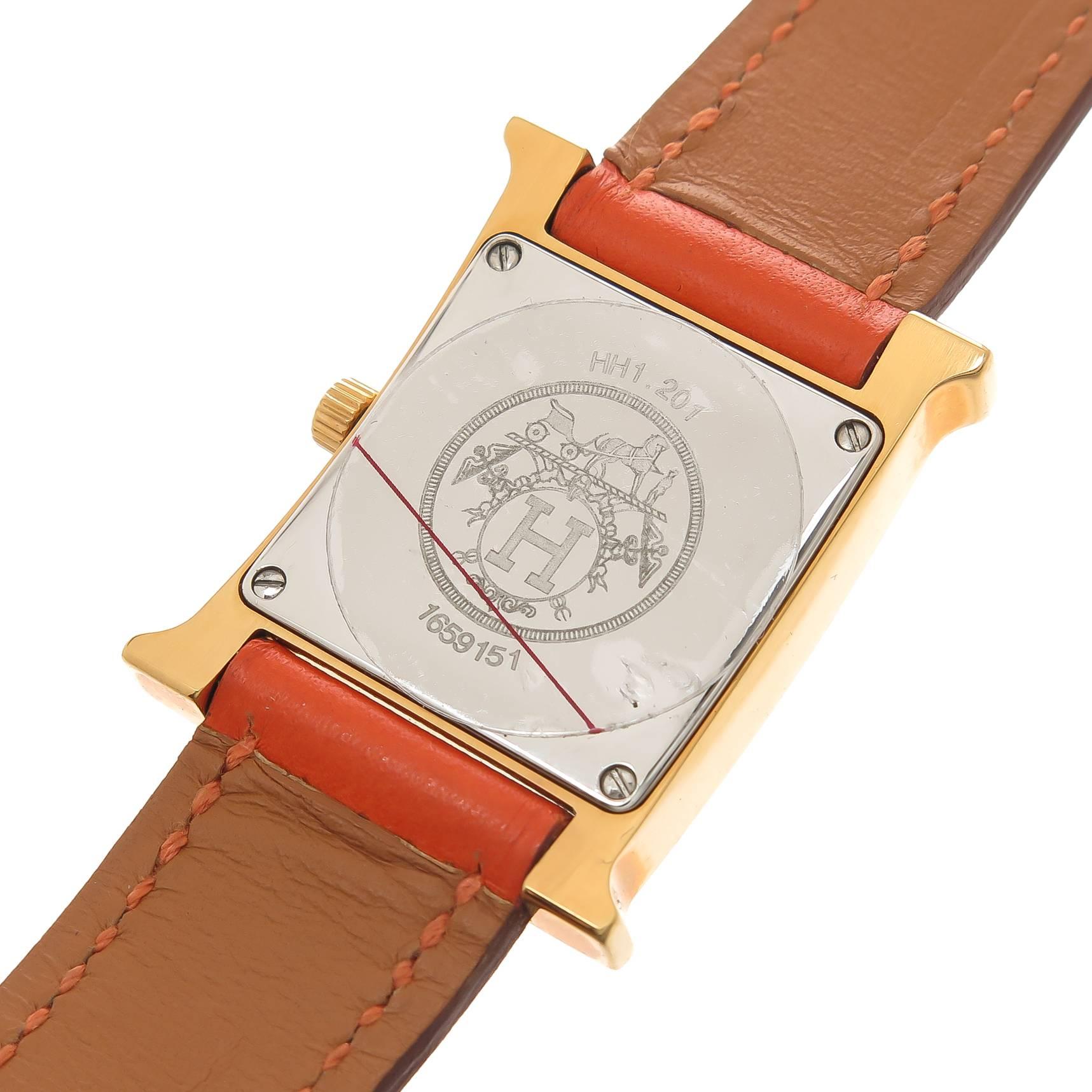 Circa 2013 Hermes Classic H Ladies Wrist watch 30 X 20 MM water resistant Gold Plate with Stainless Steel back case. Quartz movement, 