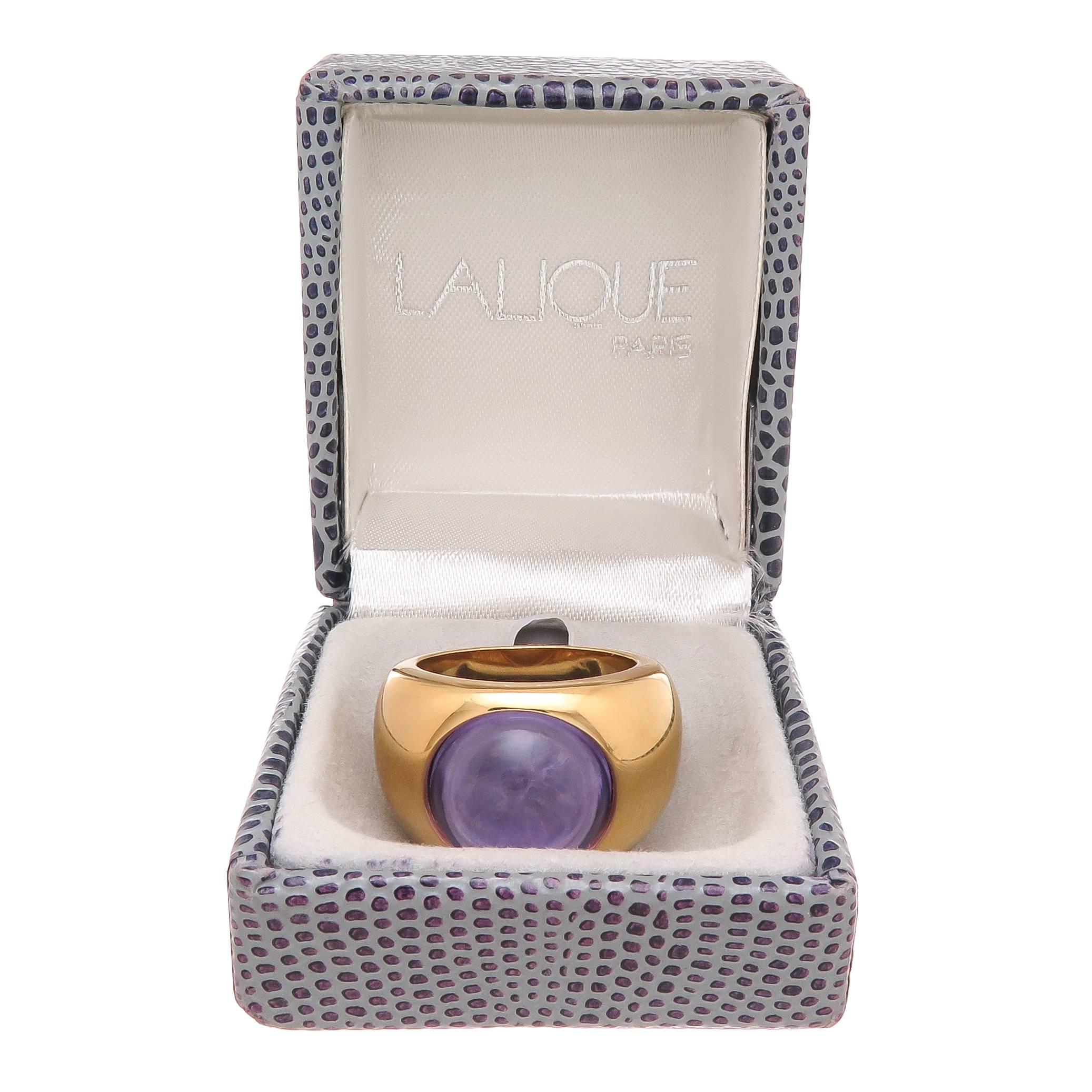 Circa 1990s Lalique Ring, Gilt metal and Centrally set with a Purple Crystal Dome. Finger size = 7 1/2, in original Lalique Box.