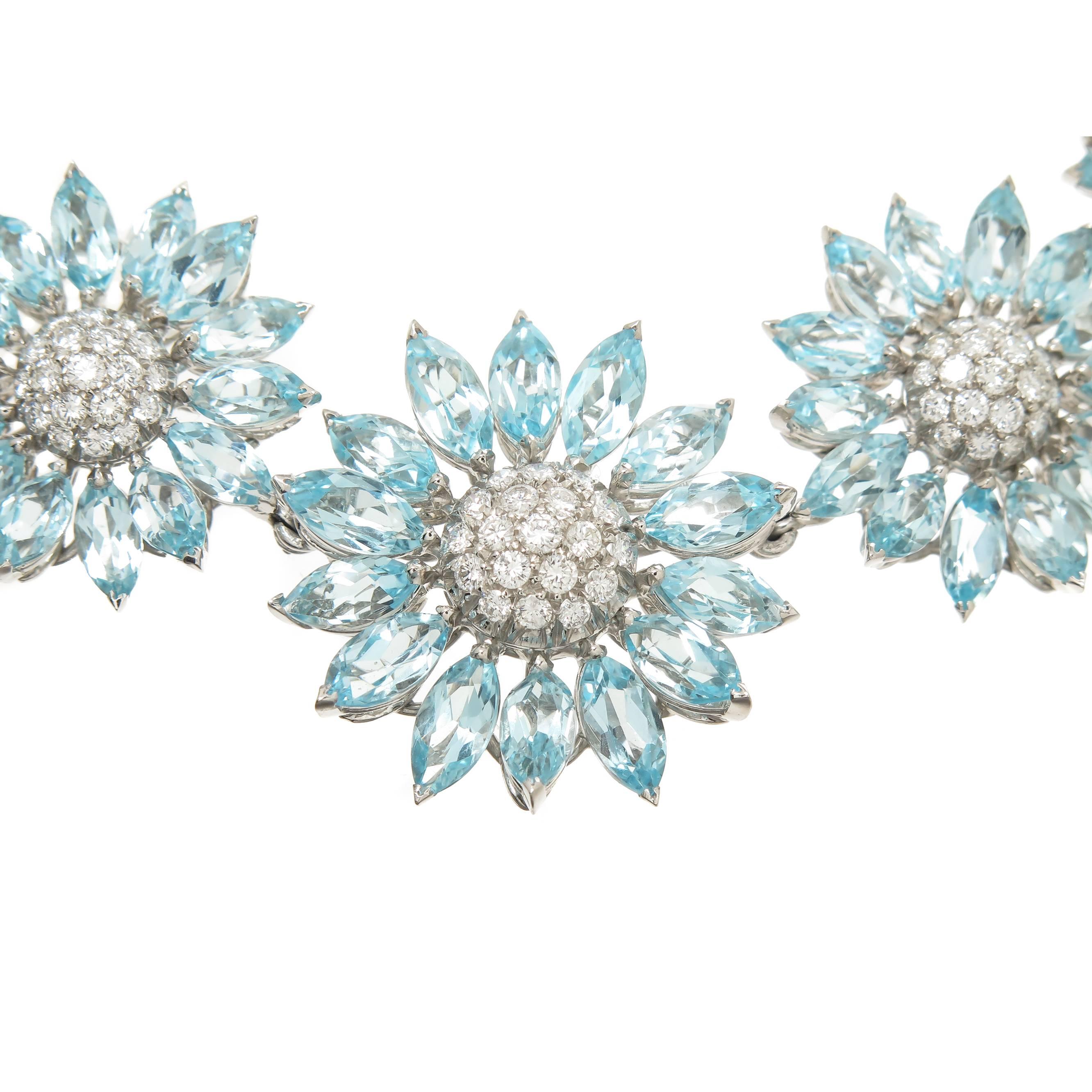 Circa 1997 Asprey 18K White Gold Diamond and Blue topaz necklace and Earring suite worn by Actress Claire Danes to the 1997 Academy Awards. The Daisy Heritage collection Necklace is made up of 24 individual Daisy Flower form sections containing Fine