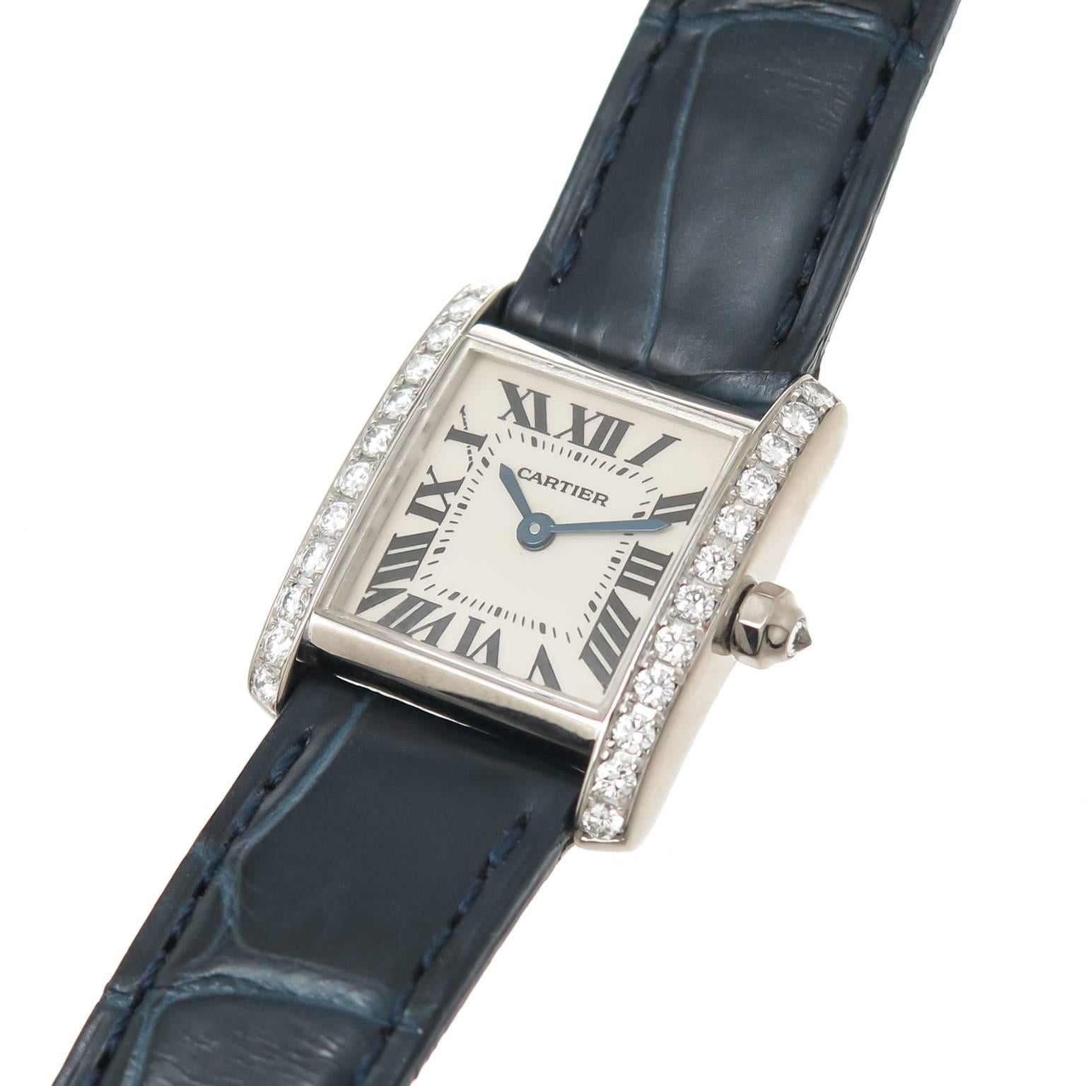 Circa 2010 Cartier Tank Francaise,18K White Gold 24 X 20 MM water resistant case.Factory Diamond set bezel totaling approximately 1 Carat and a Diamond set Crown. Quartz Movement, white Dial with Black Roman numerals, scratch resistant crystal. New