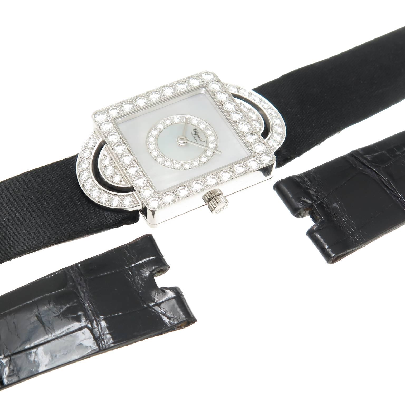 Circa 2010 Chopard Reference 13-5951, 18K white Gold 34 X 21 MM water resistant case, Fine White Round Brilliant cut Diamonds totaling 2 carats. Quartz Movement, Mother of Pearl dial set with Diamonds. Black Grosgrain Strap with Original white gold