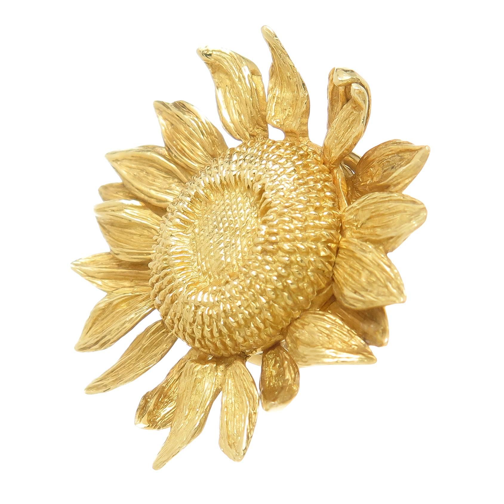 Circa 2000 Asprey 18K yellow Gold Sun Flower Earrings, owned and Worn by Dame Joan Collins. Measuring 1 1/4 inch in diameter, of solid construction and having good weight and a textured finish. Omega clip backs to which a post can be easily added if