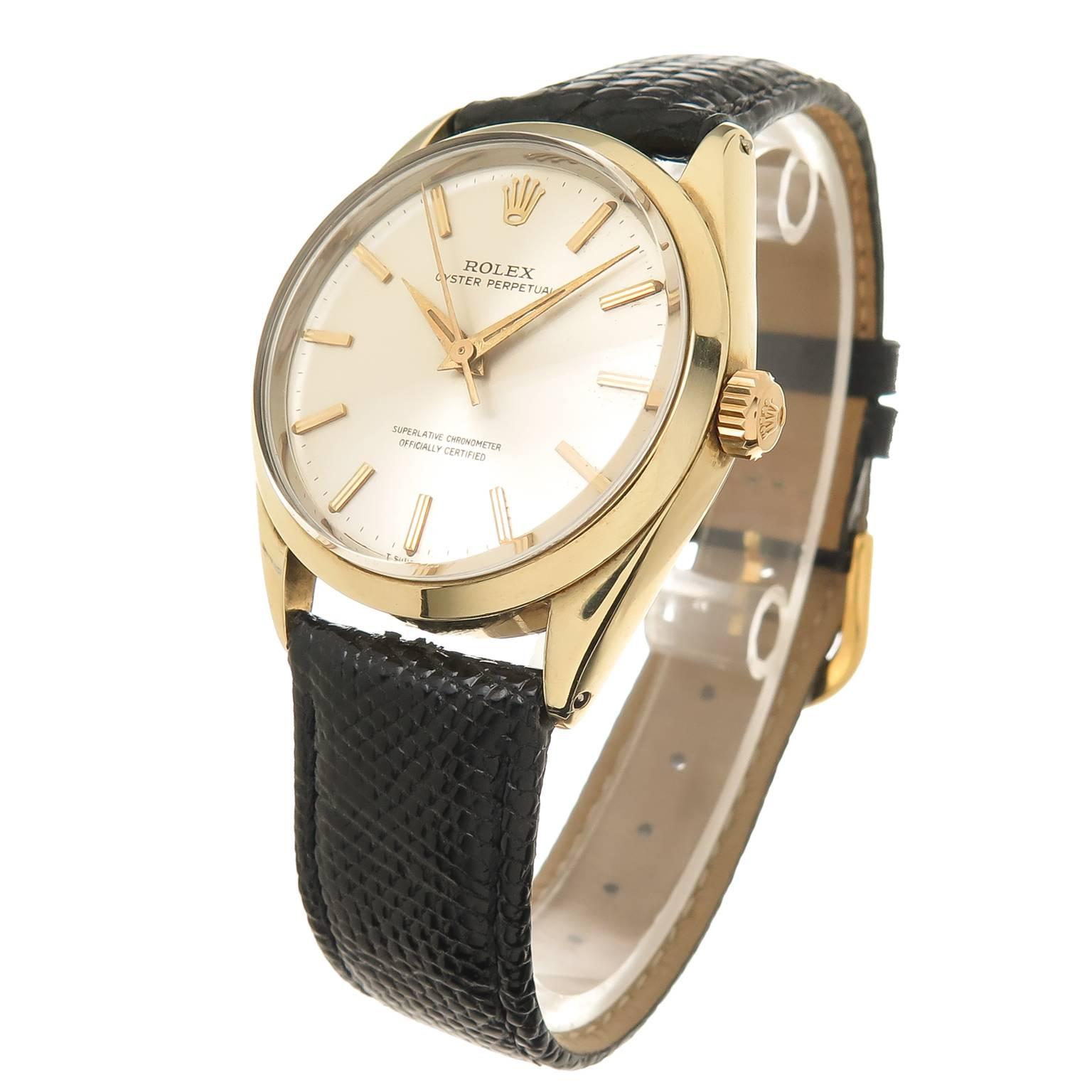 Circa 1953 Rolex Reference 1024, 34 MM Gold Shell with stainless steel back waterproof case.  Automatic, self winding Perpetual Movement. Silvered Dial with Raised Gold Markers. New Hadley Roma Black Lizard strap, recently serviced and comes with a