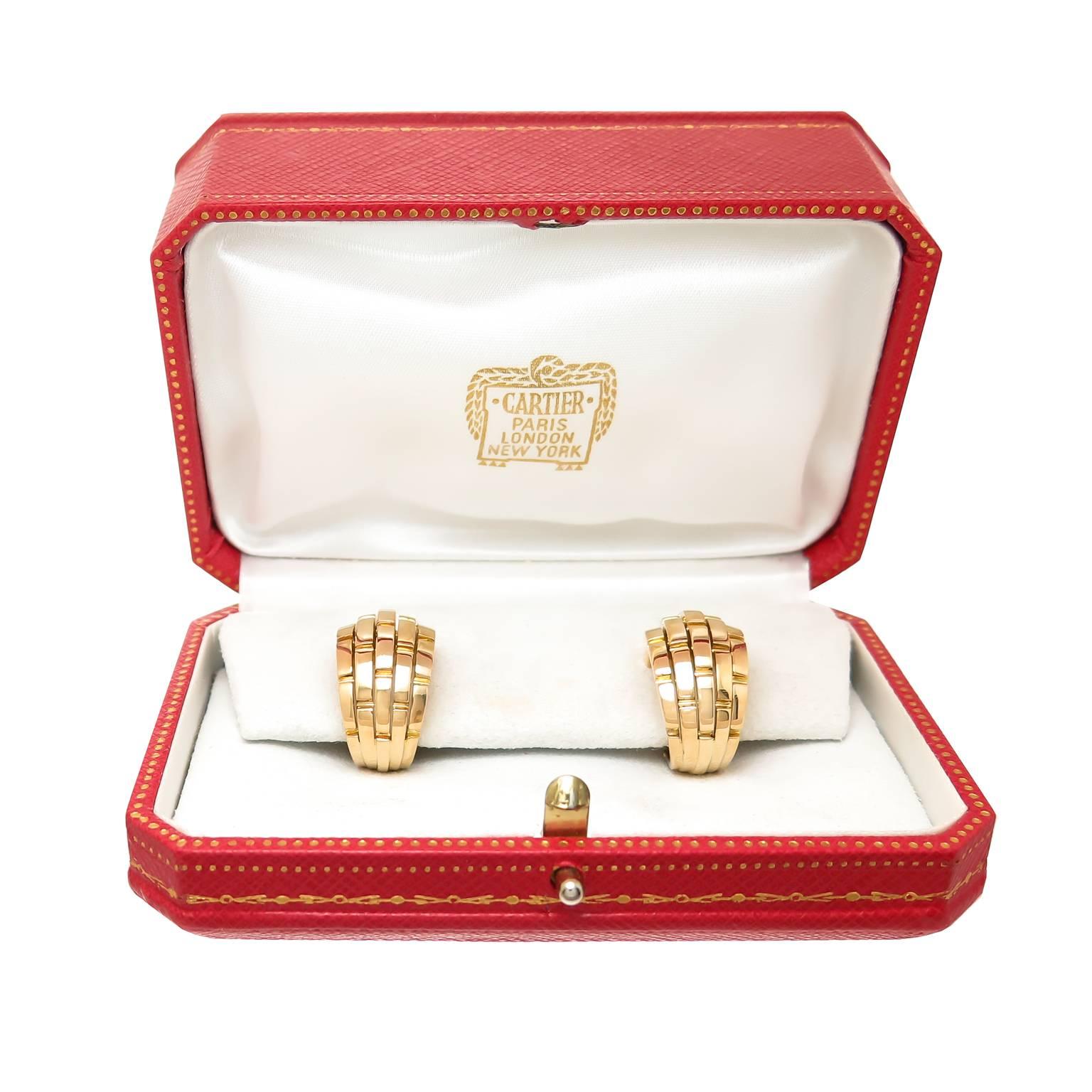 Circa 2010 Cartier 18K yellow Gold Maillon Panthere collection Earrings, measuring 7/8 inch in length and 1/2 inch wide. Solid, good weight construction and having a clip backing to which posts can be easily if desired. Signed and numbered and come