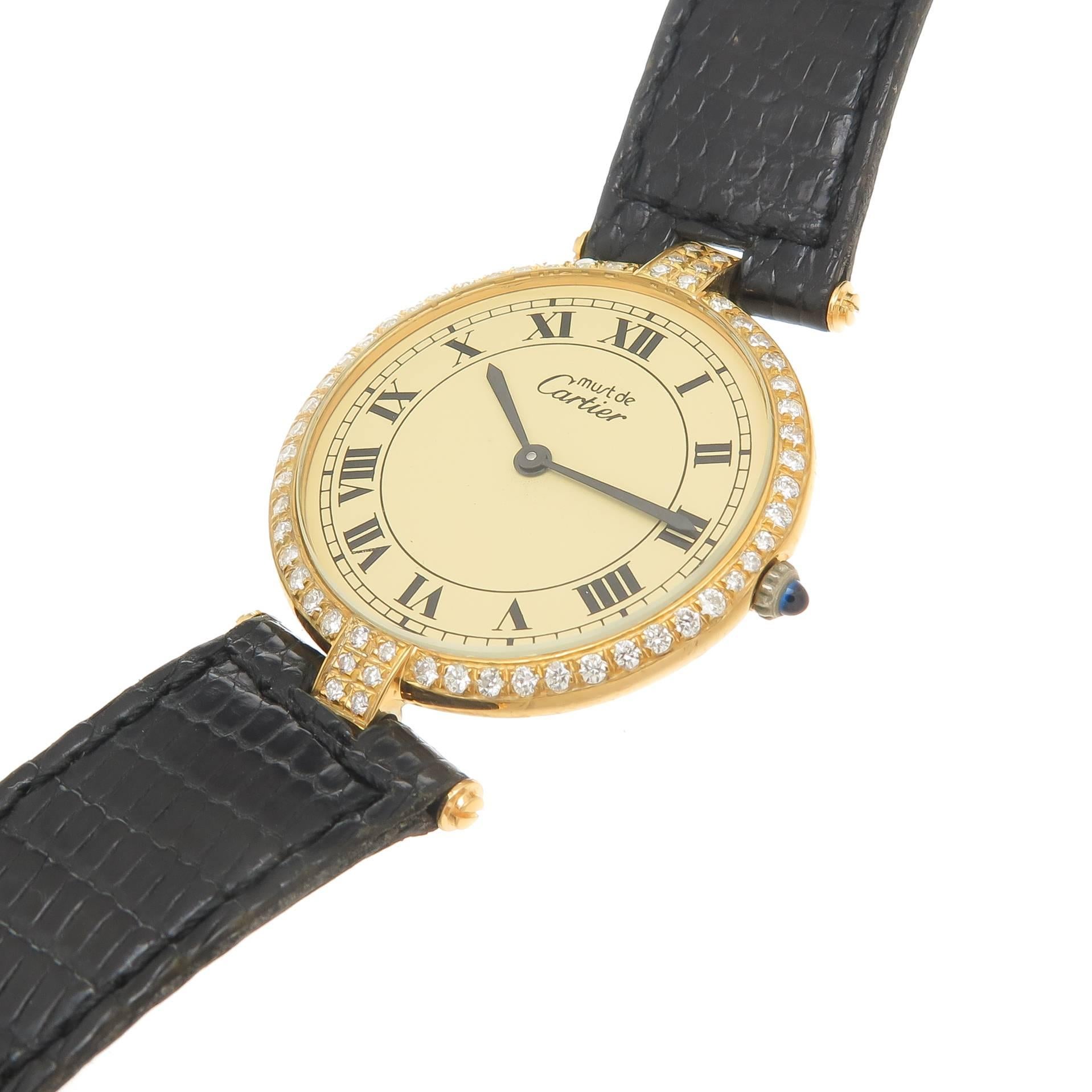 Circa 1990 Cartier Vendome Diamond set wrist Watch, 30 MM Vermeil, Gold Plated Sterling silver, water resistant case. Later Set with Round Brilliant cut diamonds totaling approximately 1 Carat. Manual wind mechanical Movement, Cream color Dial with