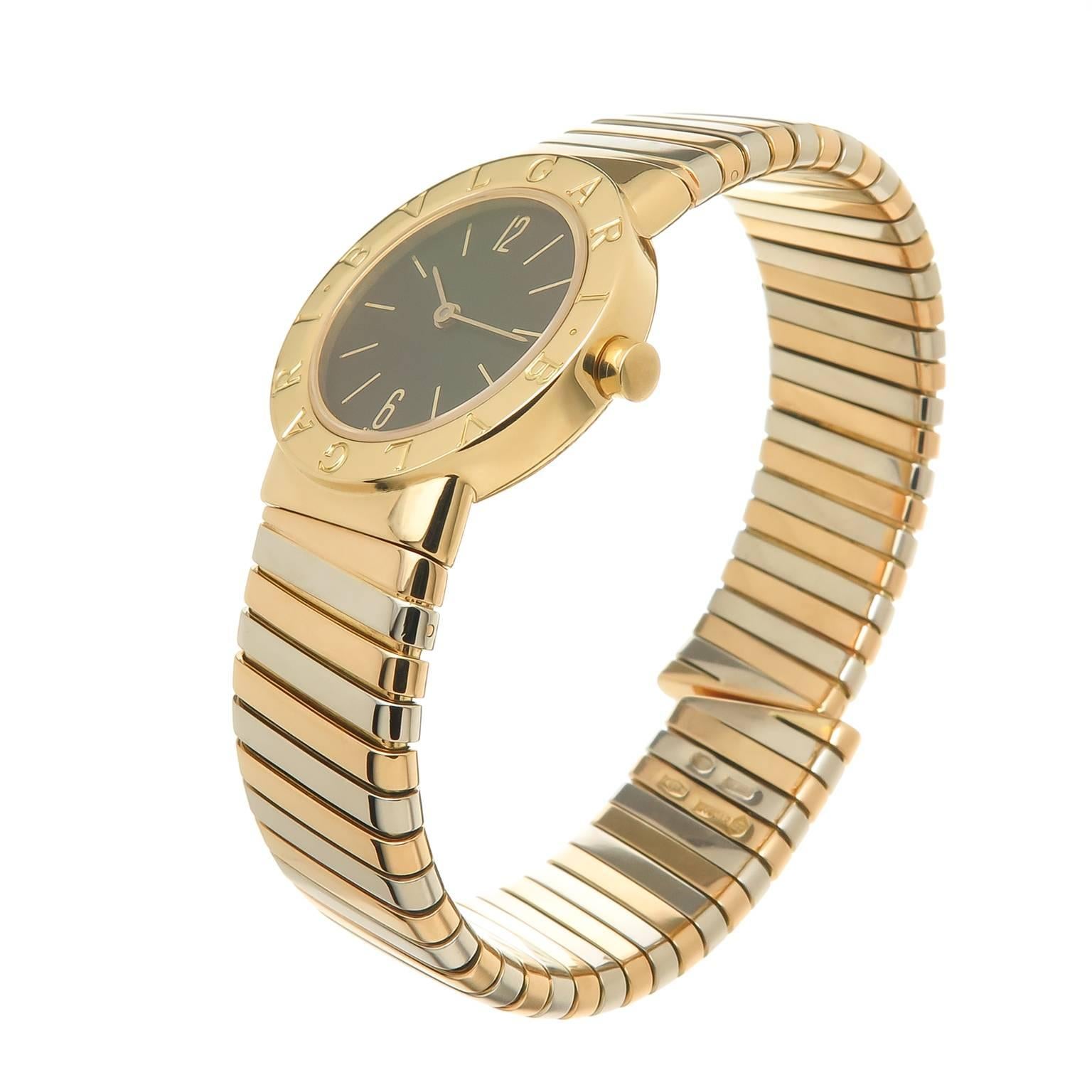 Circa 2000 Bulgari,  Tubogas Bulgari Bulgari Collection Ladies Watch, 18K Yellow, Rose and White Gold with a yellow Gold 26 MM Water resistant case, quartz movement, Black Dial with gold Markers. 5/8 inch wide Tri Color flexible bracelet that will