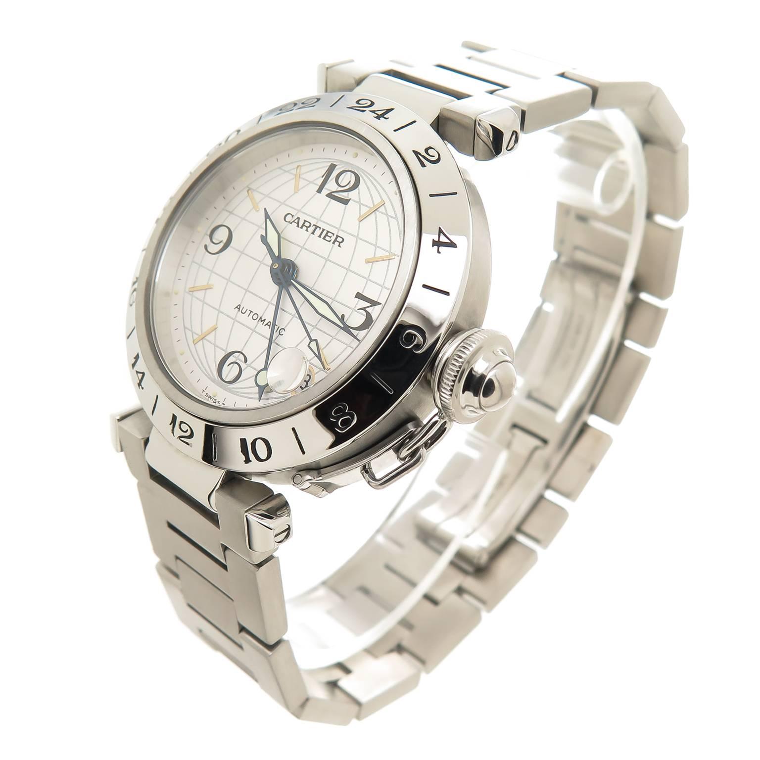 Circa 2000 Cartier Pasha C GMT, 35 MM Stainless Steel water resistant case with crown guard, Automatic, Self Winding Movement, Silver, Globe Dial with center sweep hand and a calendar window at the 5 position.3/4 inch wide Steel link bracelet with