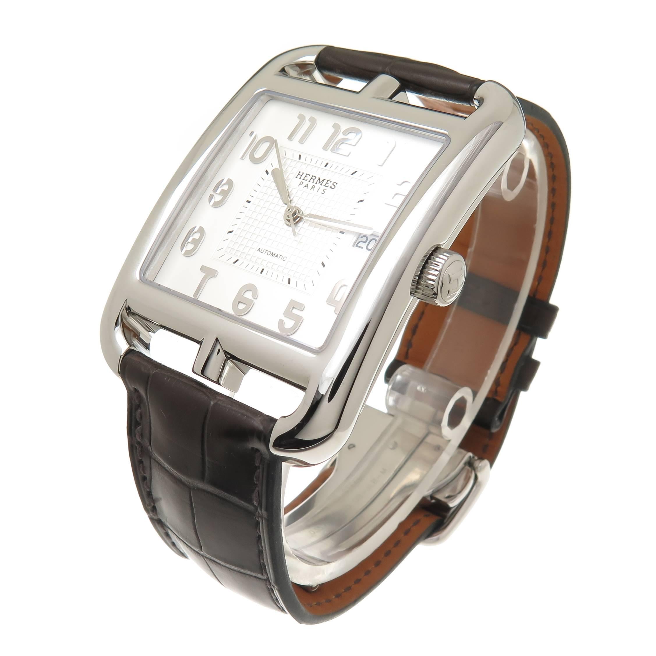 Circa 2014 Hermes Cape Cod Collection jumbo Size Wrist watch, 49 MM (lug end to end ) X 36 MM wide Stainless Steel case, Automatic, self winding movement, sweep seconds hand, Calendar window at the 3 and a White and silver dial with raised silver