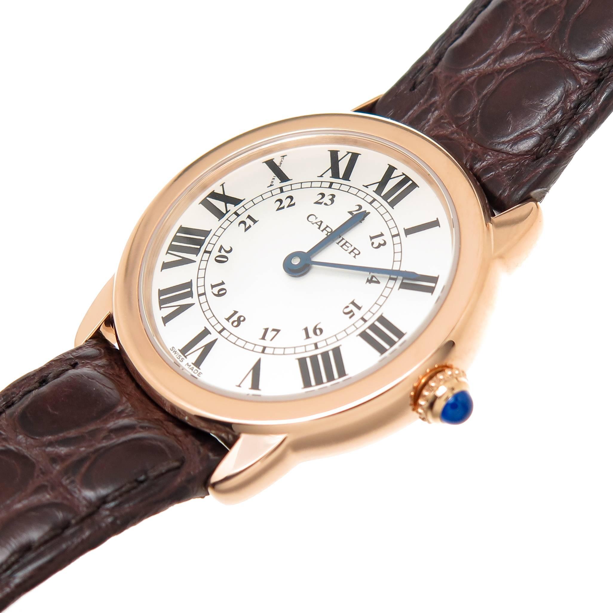 Circa 2014 Cartier Ronde Solo De Cartier, 29 MM water resistant 18K Pink Gold Case with Steel Back, Quartz Movement, Silver dial with Black Roman numerals, Sapphire crown. Brown Leather Cartier strap with a Pink Gold Cartier Tang Buckle. Recently