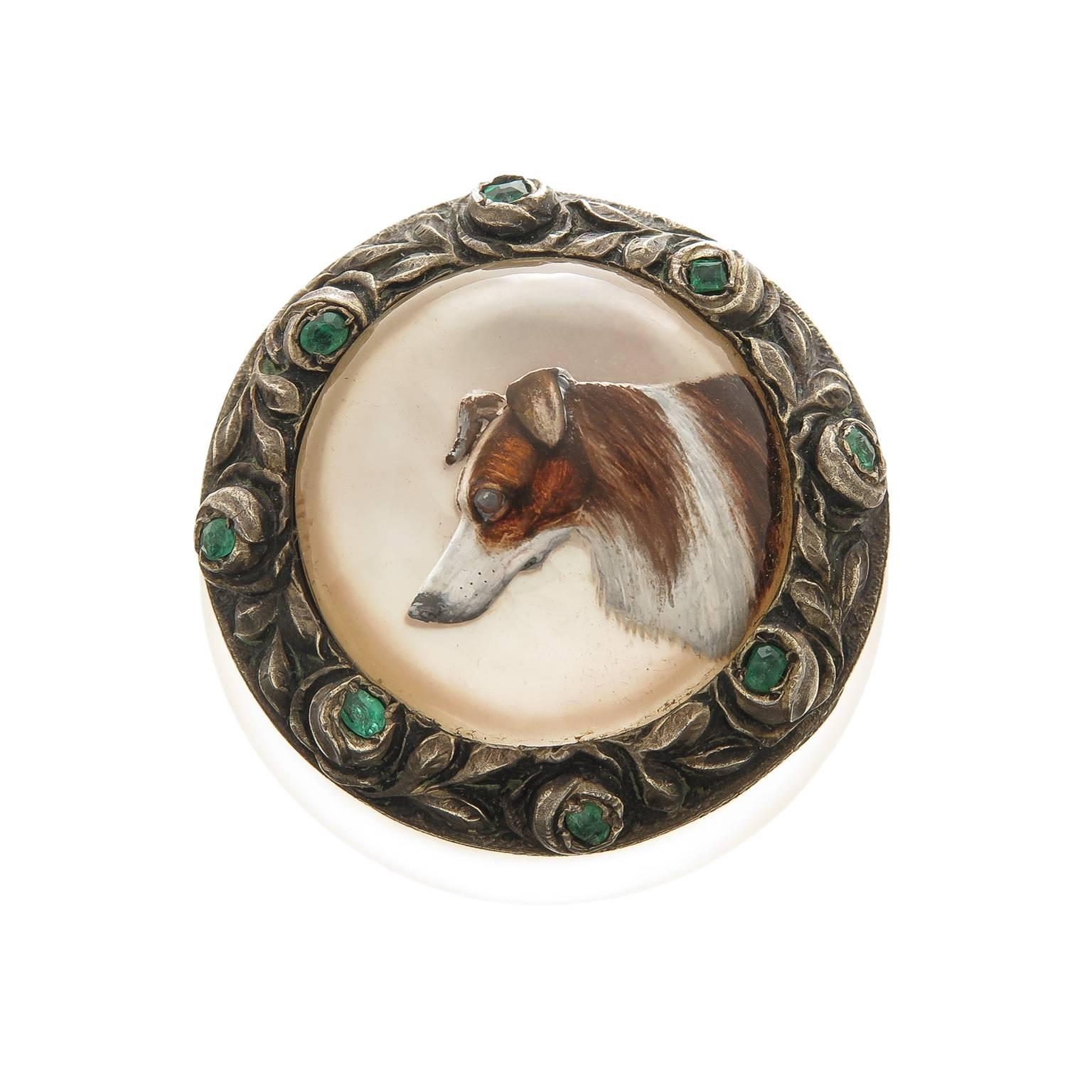Circa 1915 Frosted crystal pill or snuff box, measuring 1 1/4 inch in diameter and 1 inch in height. Having a silver hinged top with a mother of Pearl backed reverse crystal of a Collie dog that measures 3/4 inch and is of very fine quality and