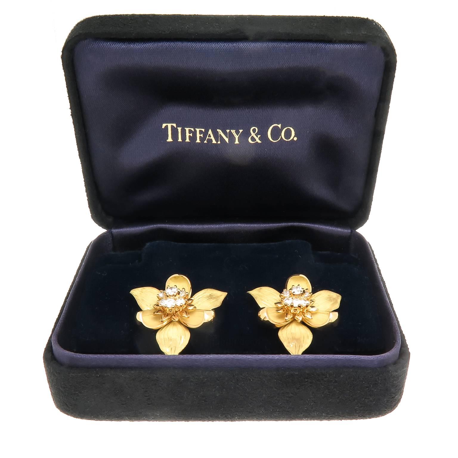 Circa 2014 Tiffany & Company Flower Earrings, 18K Yellow Gold measuring 1 inch in diameter, Textured Petals and centrally set with Round Brilliant cut Diamonds totaling .60 Carat.  Having clip backs to which a post can be easily added if desired.