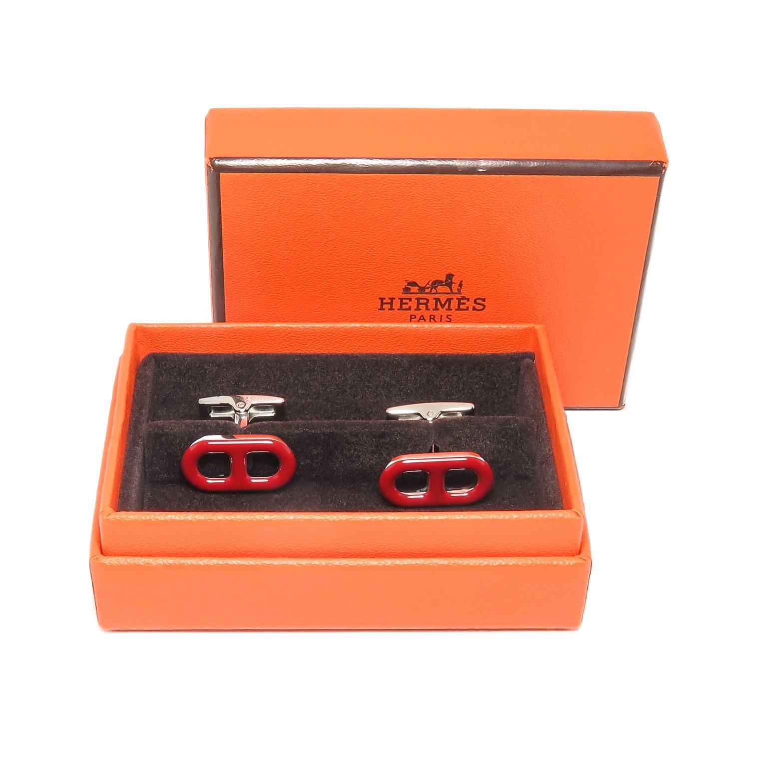 Circa 2005 Hermes Cufflinks, High Polished metal and Red Enamel, measuring 3/4 inch in length across the top, these are new old stock, never worn and come in the original Hermes Gift Box.