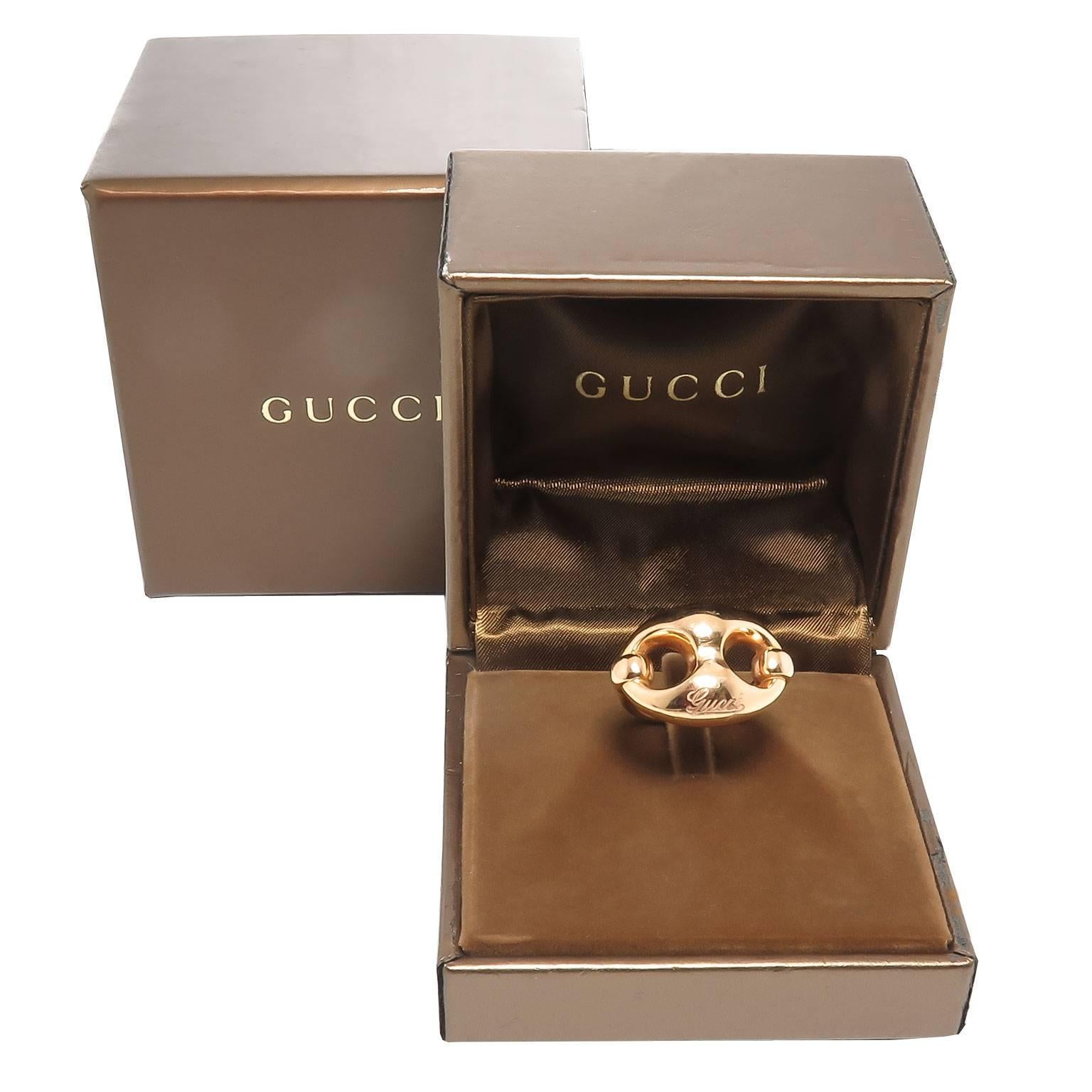 Circa 2010 Gucci 18K Yellow Gold Horse Bit Ring. Measuring 1 inch across the top and weighing 15 Grams. Comes in the original Gucci Presentation box.