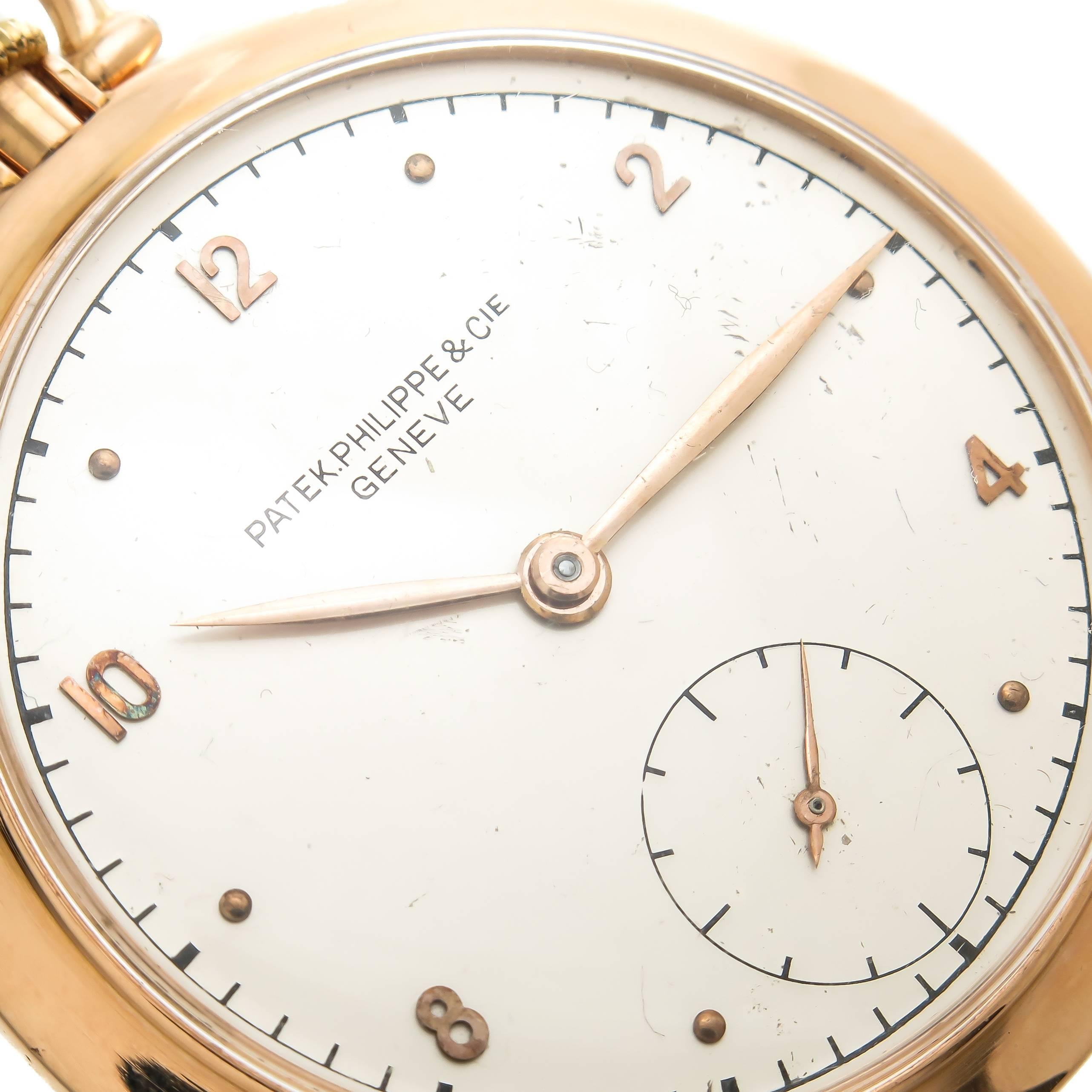 Circa 1940s Patek Philippe Pocket watch, 46 MM 2 Piece 18K Rose Gold Case, 9 MM thick. 18 Jewel Mechanical, manual wind Nickel Lever Movement. Silvered Dial with Raised Rose Gold Markers and Rose Gold Hands. Signed and Numbered Case and Movement.