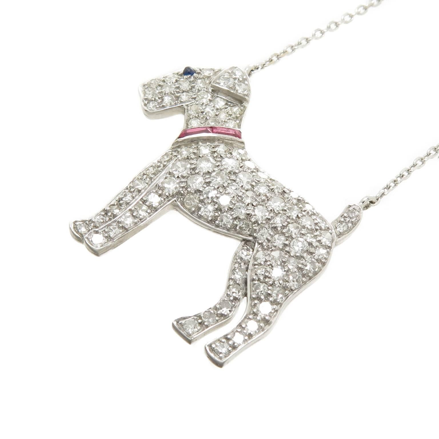 Circa 1930s Terrier Dog  Platinum Pendant, originally a Brooch this piece measures 1 1/16 X 1 inch and is attached to a 20 inch adjustable 18K white Gold Chain. Set with old cut Diamonds totaling over 1 carat and further set with Baguette Rubies for