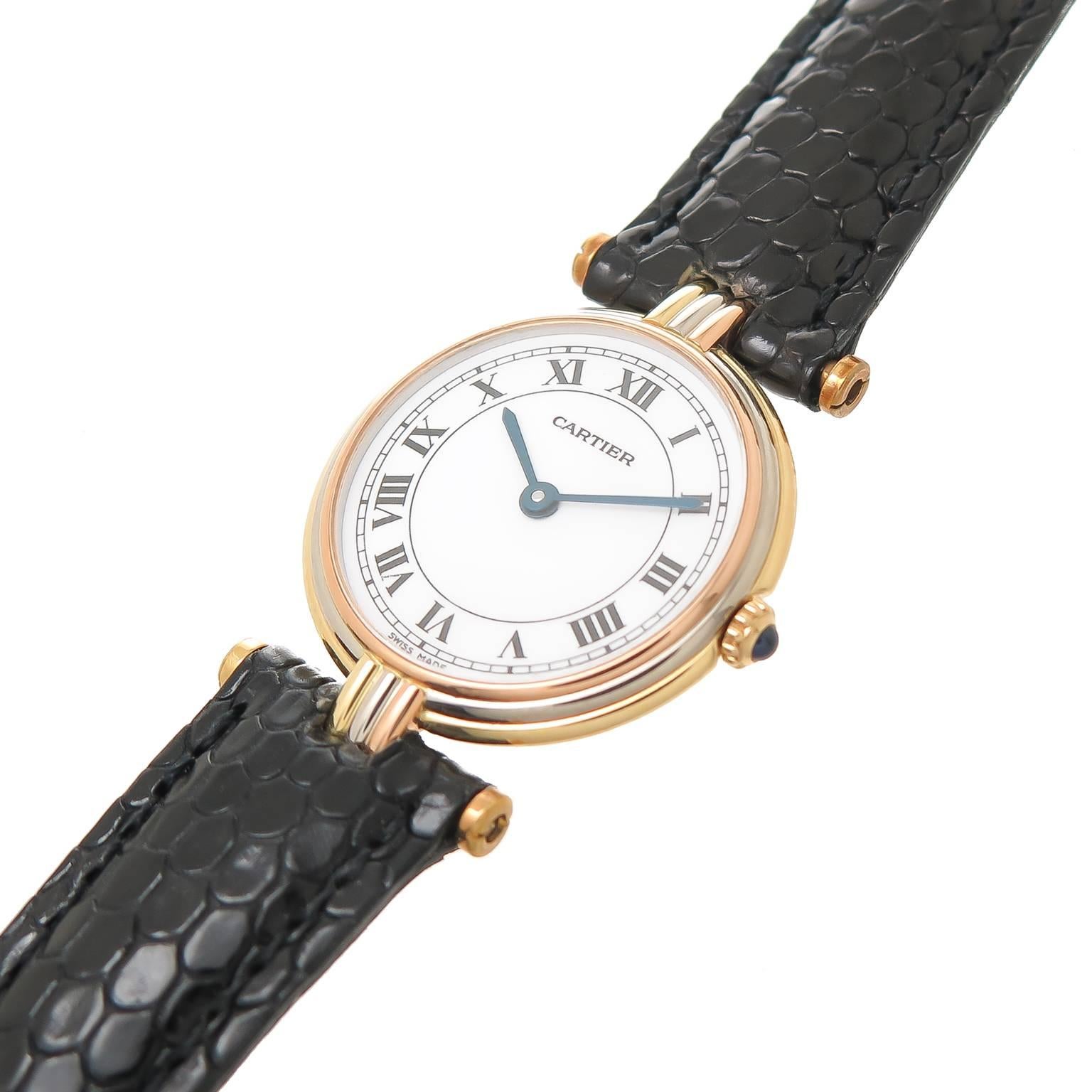 Circa 1990 Cartier 18K Yellow, White and Rose Gold Vendome Ladies Wrist Watch. 25 MM water resistant stepped case, Quartz Movement, White Dial with Black Roman Numerals, Sapphire Crown. New Black lizard Lizard Strap with Cartier gold plate tang
