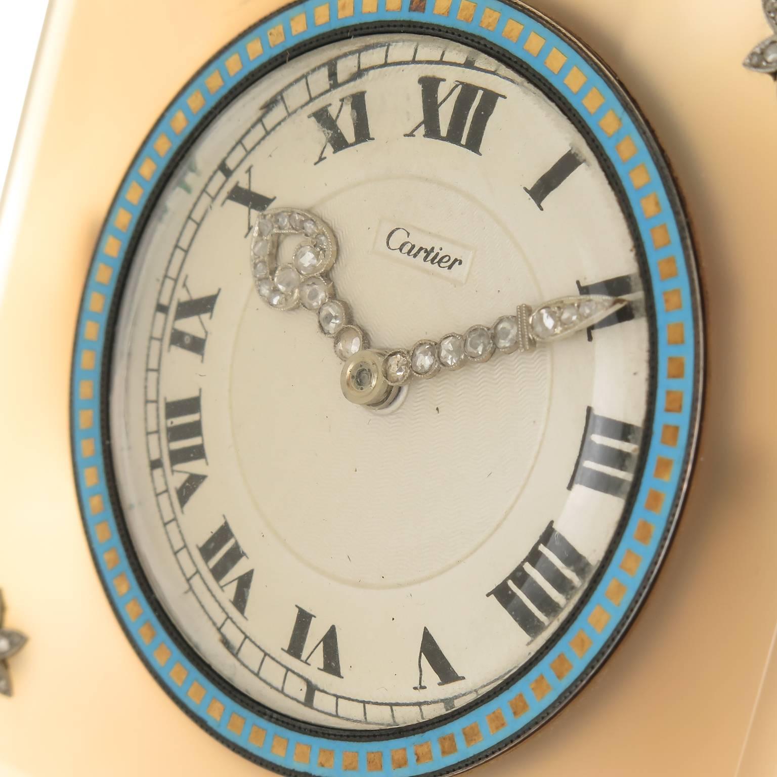 Circa 1920 Cartier Desk Clock, Beveled Agate measuring 3 X 3 inch, Enameled Gilt metal Bezel and 4 Platinum Star elements set with Rose cut Diamonds. White engine turned dial with Platinum and Rose cut Diamond set hands. Gilt metal folding easel