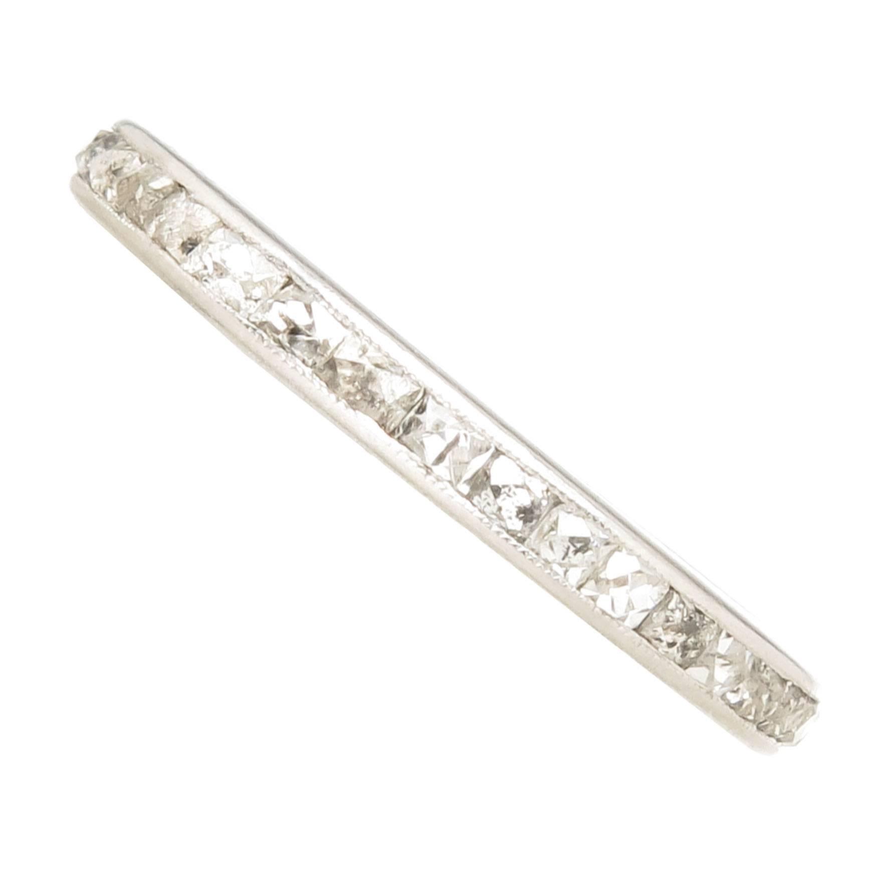 Circa 1920 Platinum Band Ring set with French Cut Diamonds, the band measures 2 MM wide and is a Finger size 5 1/4. The French Cut Diamonds total approximately 1 Carat and Grade as K-L in Color and Si2 to I1 in Clarity. 