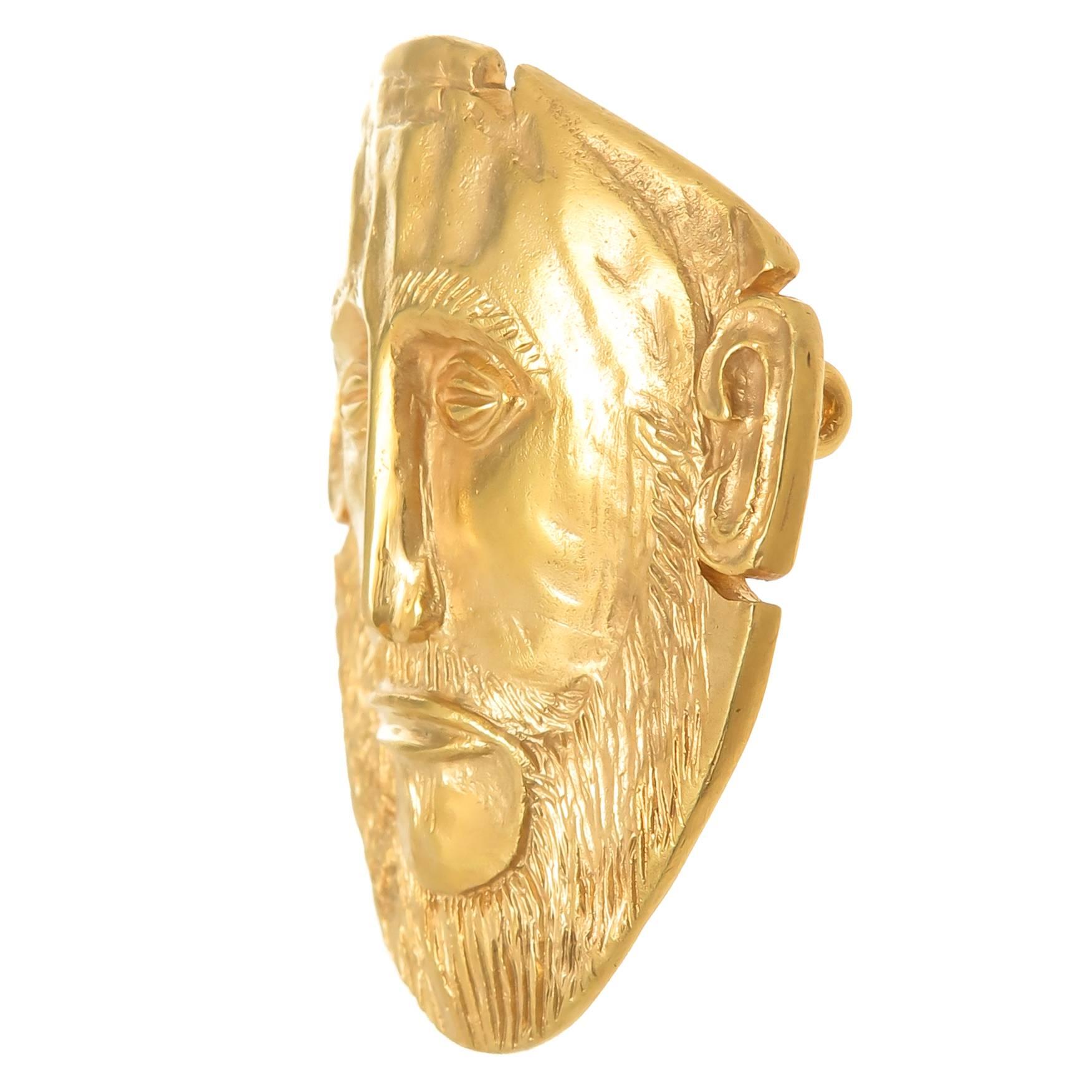 Circa 1990 Zolotas 18K Yellow Gold Pendant Brooch of a Mask in an Ancient Roman Greek Design, measuring 1 3/4 X 1 3/4 inch and having very fine detailing.  Weighing 21.3 Grams.