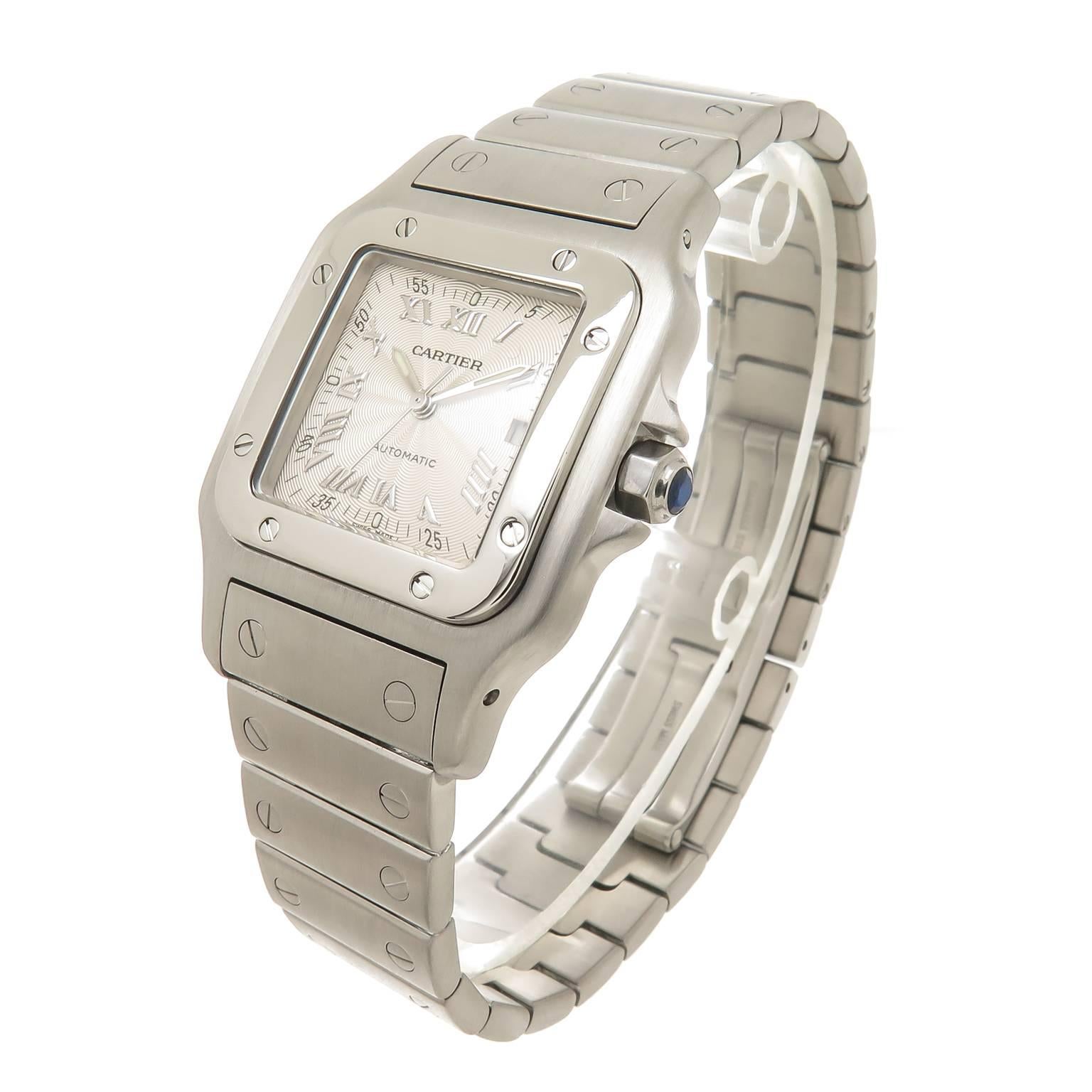 Circa 2005 Cartier Santos Galbee Wrist Watch, 41 X 29 MM Stainless Steel Water Resistant case. Automatic, self winding Movement, Silver Engine Turned Dial with Raised Silver Markers, sweep seconds hand, Calendar window at the 3 position, scratch