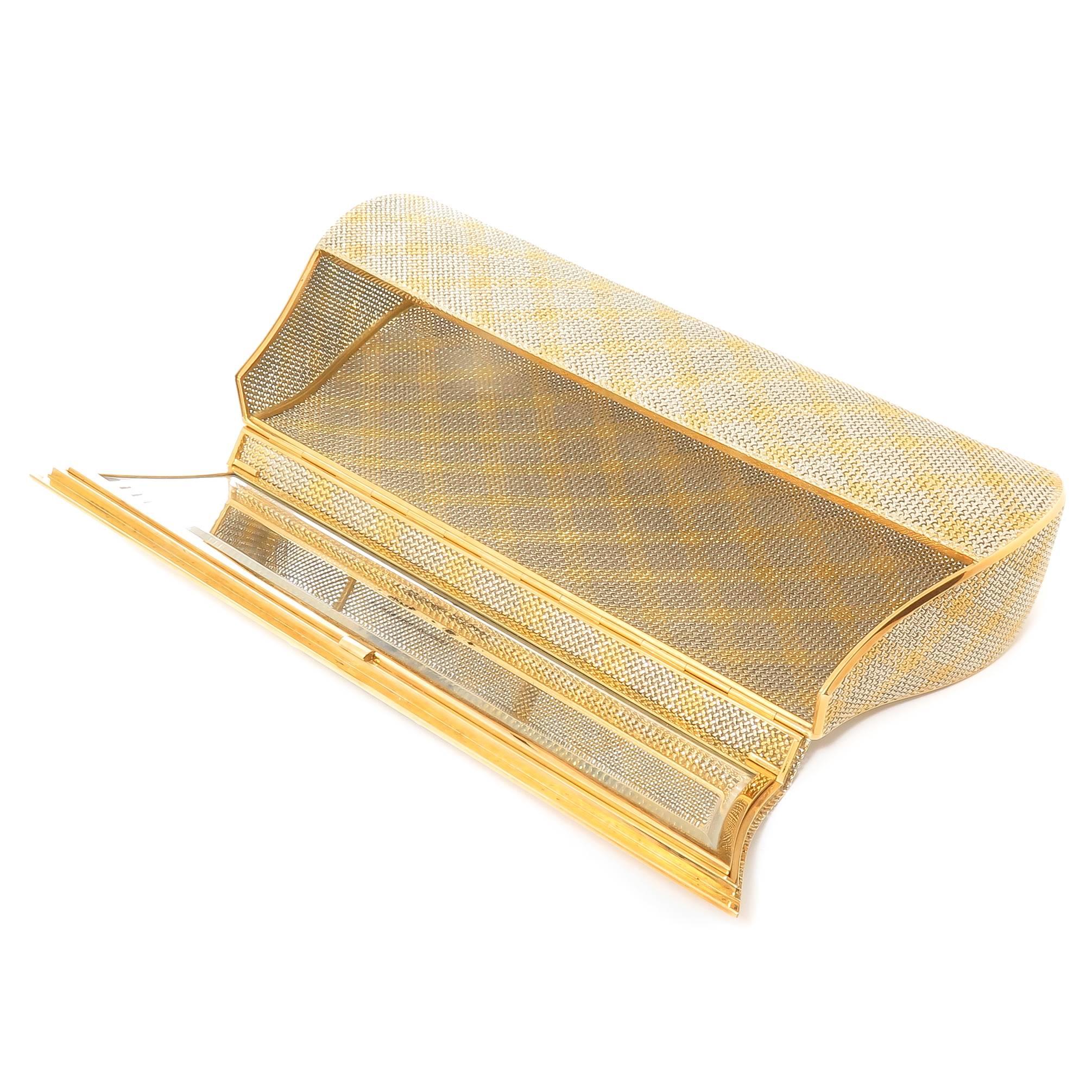 Circa 1980s Bulgari 18K Yellow and White Gold Woven Evening Clutch Bag, measuring 7 5/8 inch in length 3 1/2 inch in height and 1 1/2 inch wide. Having a Mirror inside the lid, the interior is very spacious. Weighing 371 Grams. Signed, Numbered and