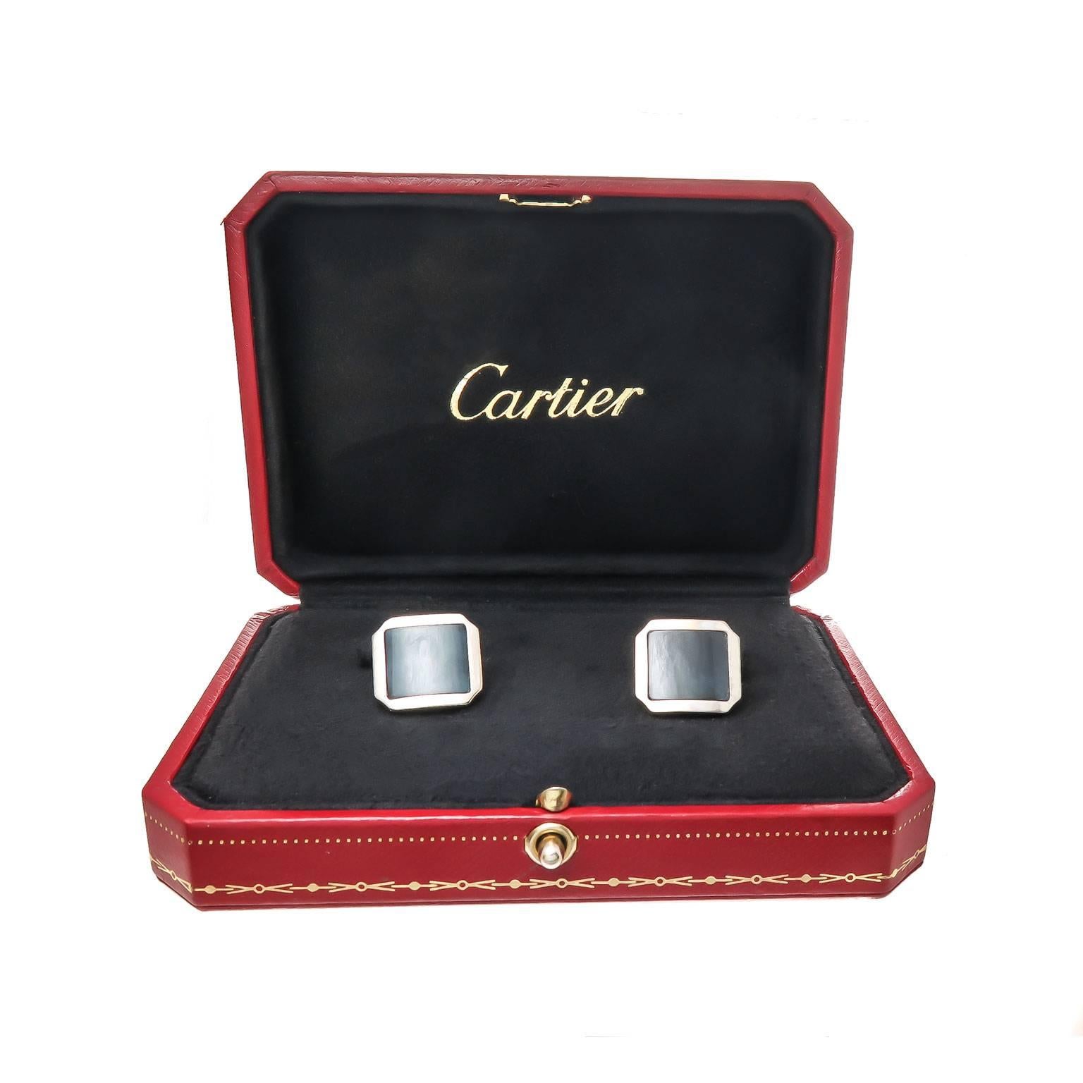 Circa 2005 Cartier 18K White Gold cufflinks set with a Charcoal Gray Quartz also known as eagle Eye Quartz. the tops measure 5/8 X 5/8 inch.  Signed and numbered and come in the original Cufflink presentation Box. 