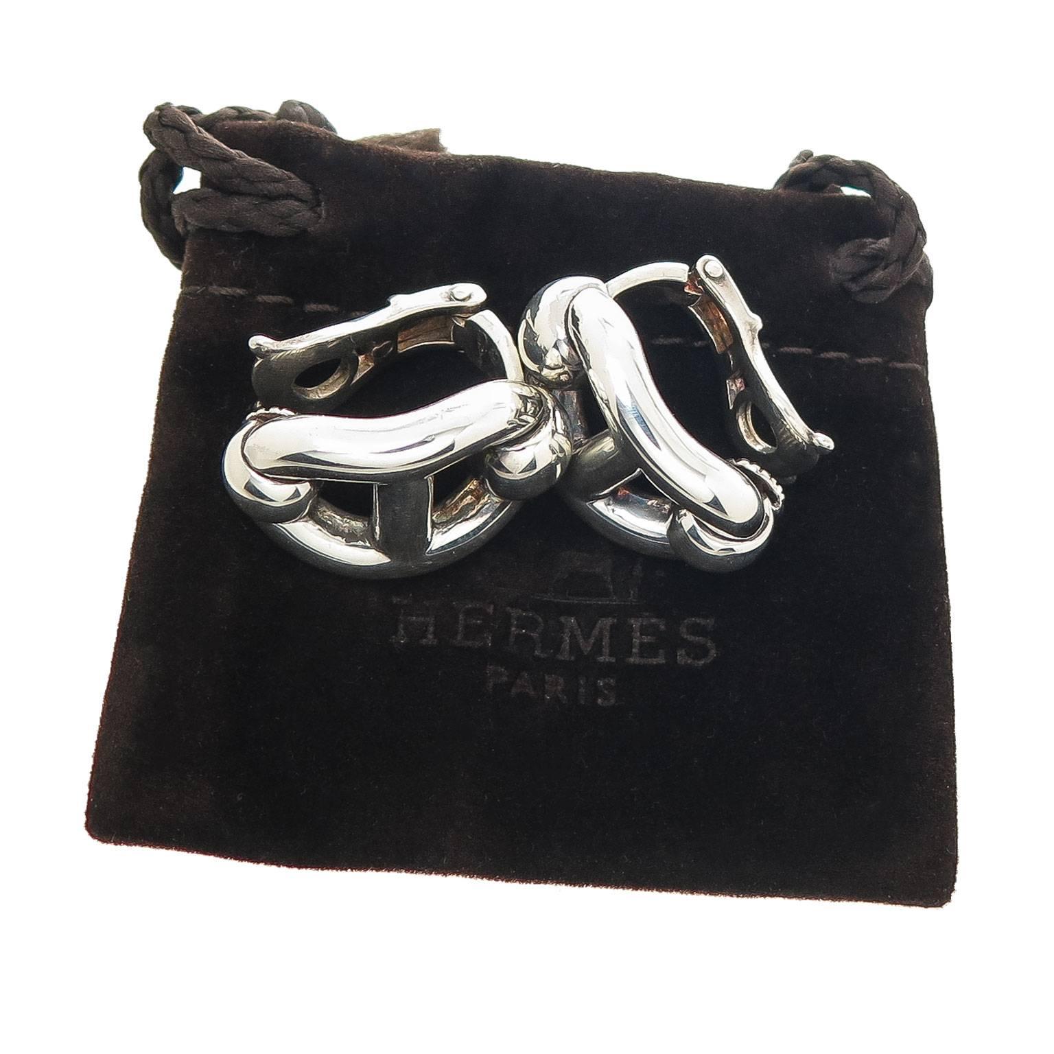 Circa 2005 Hermes Chaine D' Ancre Sterling Silver Earrings, measuring 7/8 inch in length and 1/2 inch wide. Having Clip backs to which a post can be easily added if desired. Comes in original Hermes travel pouch.