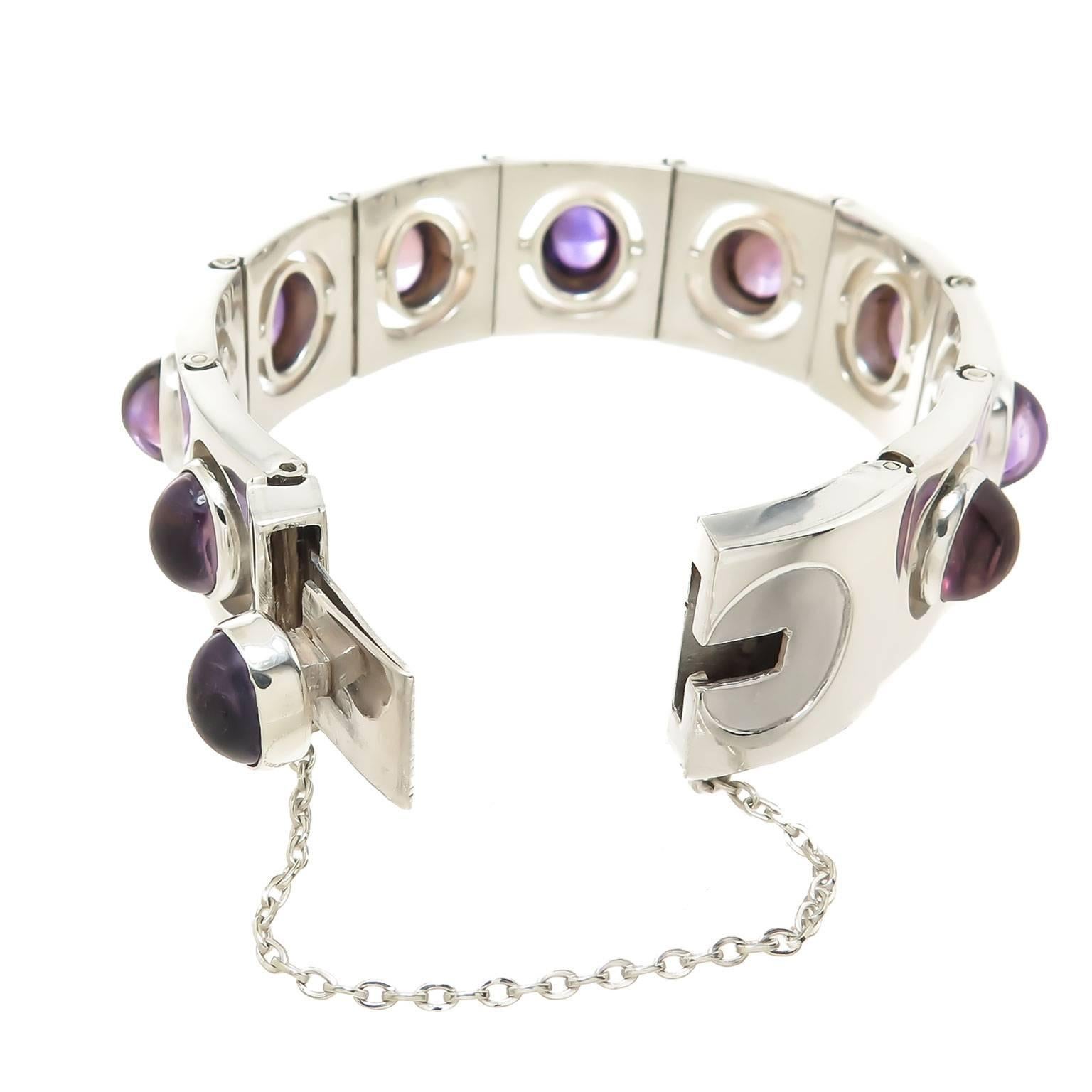 Circa 1960 Antonio Pineda Sterling silver Bracelet, the Bracelet is comprised of individually hinged square links that fit very flush together and each are set with a Very fine color cabochon Amethyst that measure 3/8 x 3/8 inch. The bracelet