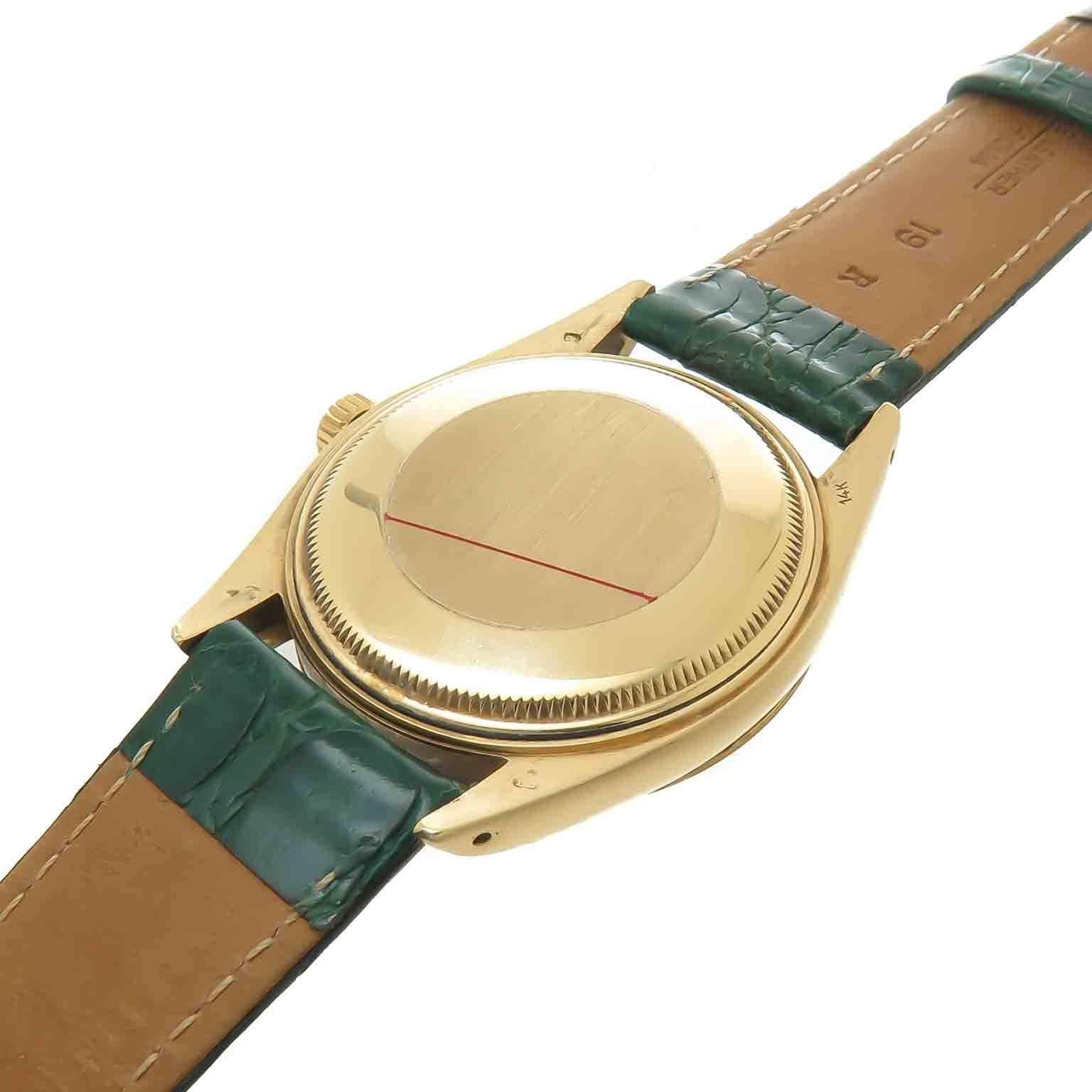 Circa 1978 Rolex reference 1503, 34 MM 14K Yellow Gold 3 Piece Water proof Case with Fluted Bezel. Caliber 1570 Automatic, self Winding movement. Original Gold Dial with Diamond set markers, Calendar window at the 3 position and acrylic crystal. New