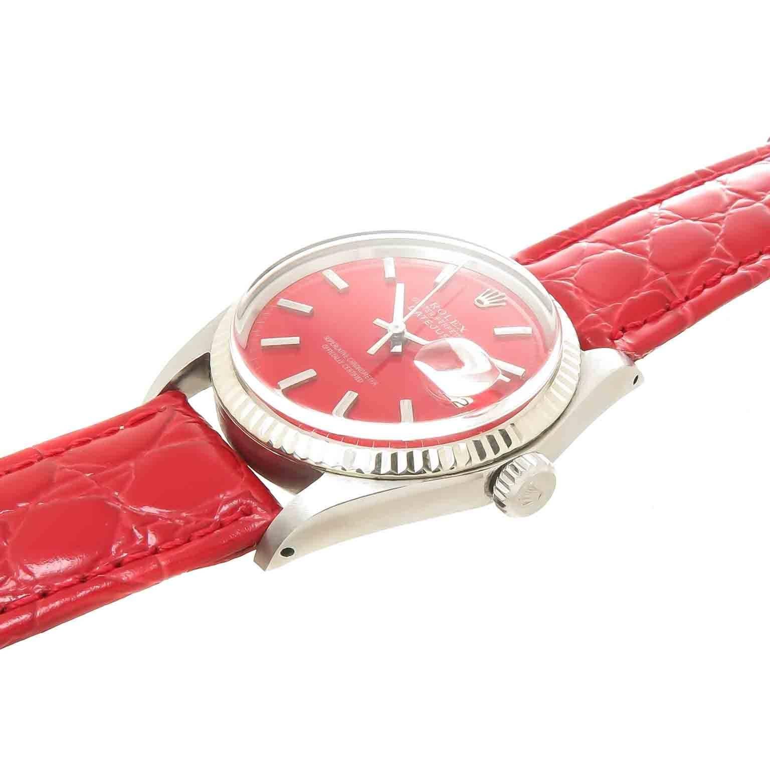 Circa 1968 Rolex Datejust, 36 MM Reference 1601 Stainless Steel Waterproof Oyster case with Fluted Bezel, Caliber 1575 Automatic, self winding movement. Custom Red Dial with Raised markers, sweep seconds hand and a Calendar window at the 3 position,