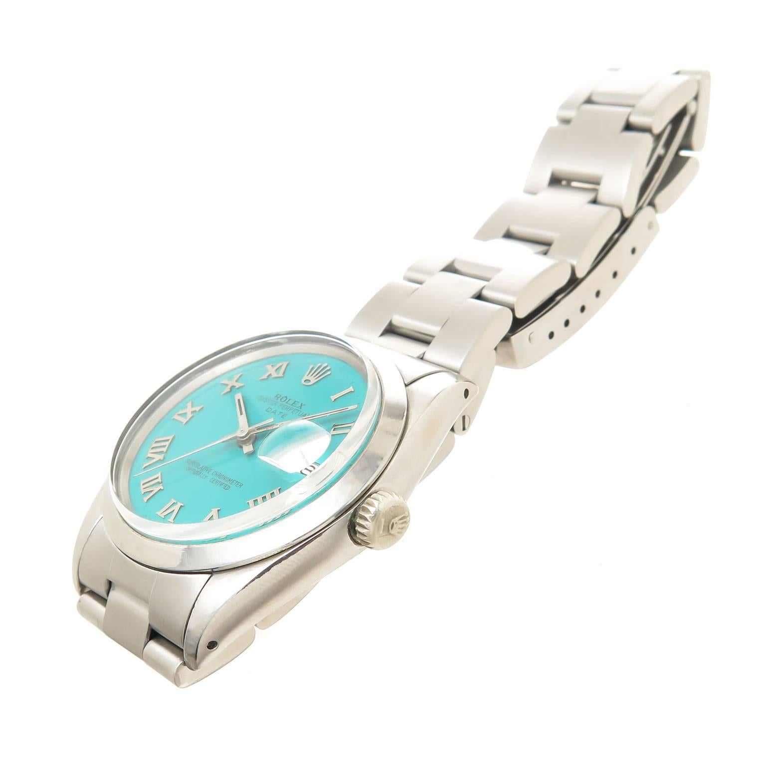 Circa 1965 Rolex Date Model, Reference 1500 Gents Wrist watch, 34 MM Stainless Steel Water proof Oyster case with Smooth Bezel. Caliber 1570 26 Jewel, automatic, self winding movement. Custom Turquoise Blue Dial with Raised Roman Numeral Markers,