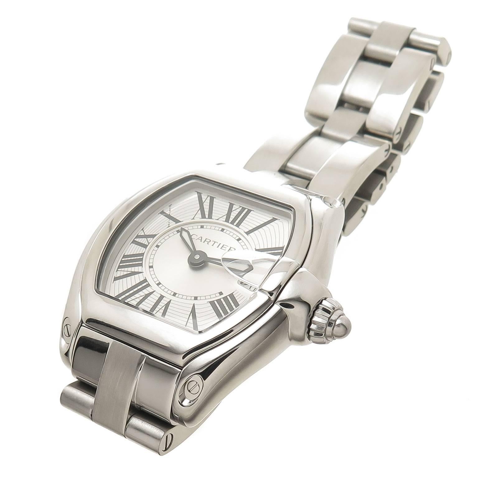 Circa 2012 Cartier Ladies Roadster Wrist watch, 37 X 31 MM Stainless Steel Water resistant Case. Quartz Movement, Silver Engine Turned Dial with Black roman Numerals and a Calendar window at the 3 position. 5/8 inch wide Stainless Steel Bracelet