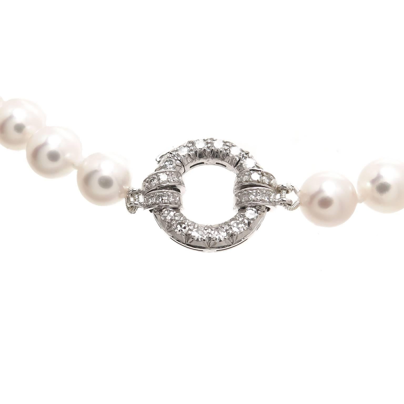Circa 2000 Vacheron & Constantin, Geneve 36 Inch Pearl Necklace. 7.5 MM round individually knotted, Fine White luster with a light Pink hue, Diamond set 18K white Gold Clasp. Comes in Original Vacheron signed Suede Holder. Excellent condition,