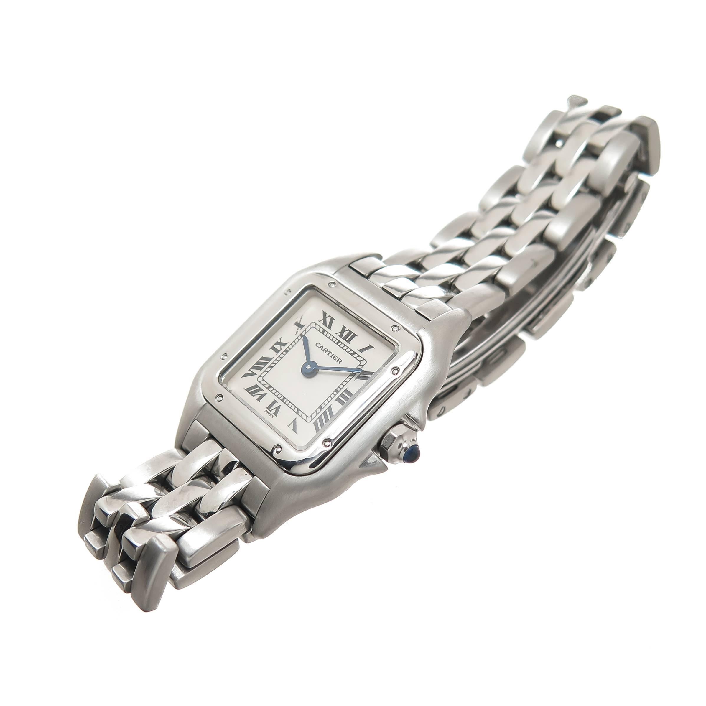 Circa 2005 Cartier Classic Panther Ladies Wrist watch, 29 X 21 MM Stainless Steel case, Quartz Movement, White Dial with Black Roman Numerals, scratch resistant crystal and a sapphire Crown. 1/2 inch wide Stainless Steel Panther Link Bracelet with