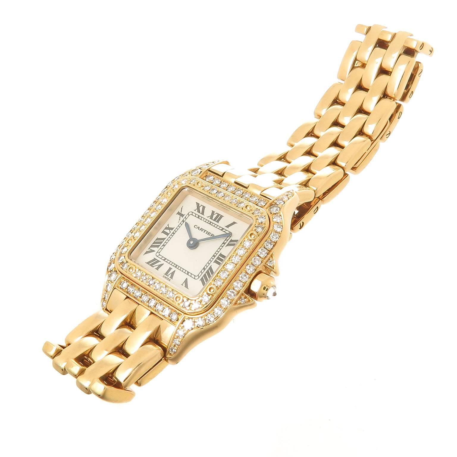 Circa 1990s Cartier Ladies Panther Wrist watch, 29 X 21 MM 18K yellow Gold Water resistant case. Diamond set Case and Bezel totaling 1.60 carat.  Quartz movement, White Dial with Black Roman Numerals, scratch resistant crystal and a Diamond Set