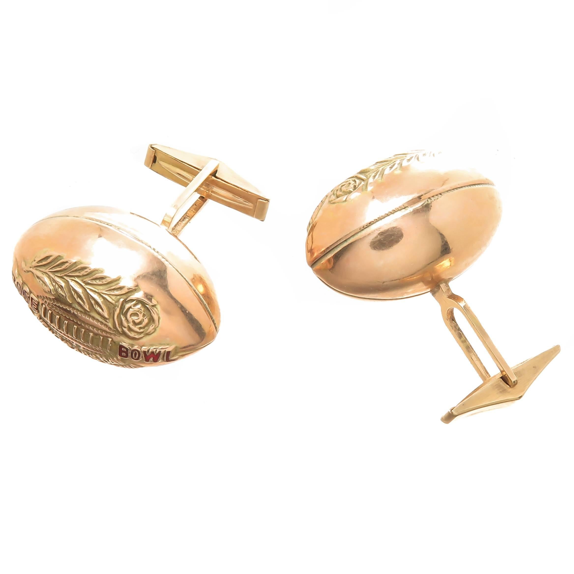 Circa 1960 14K Yellow Gold Rose Bowl Presentation Cufflinks. Football Shaped with Raised embossing and Red Enamel, measuring 1 1/8 inch in length and weighing 21 Grams. These were most likely made as presentation to game officials, winning team