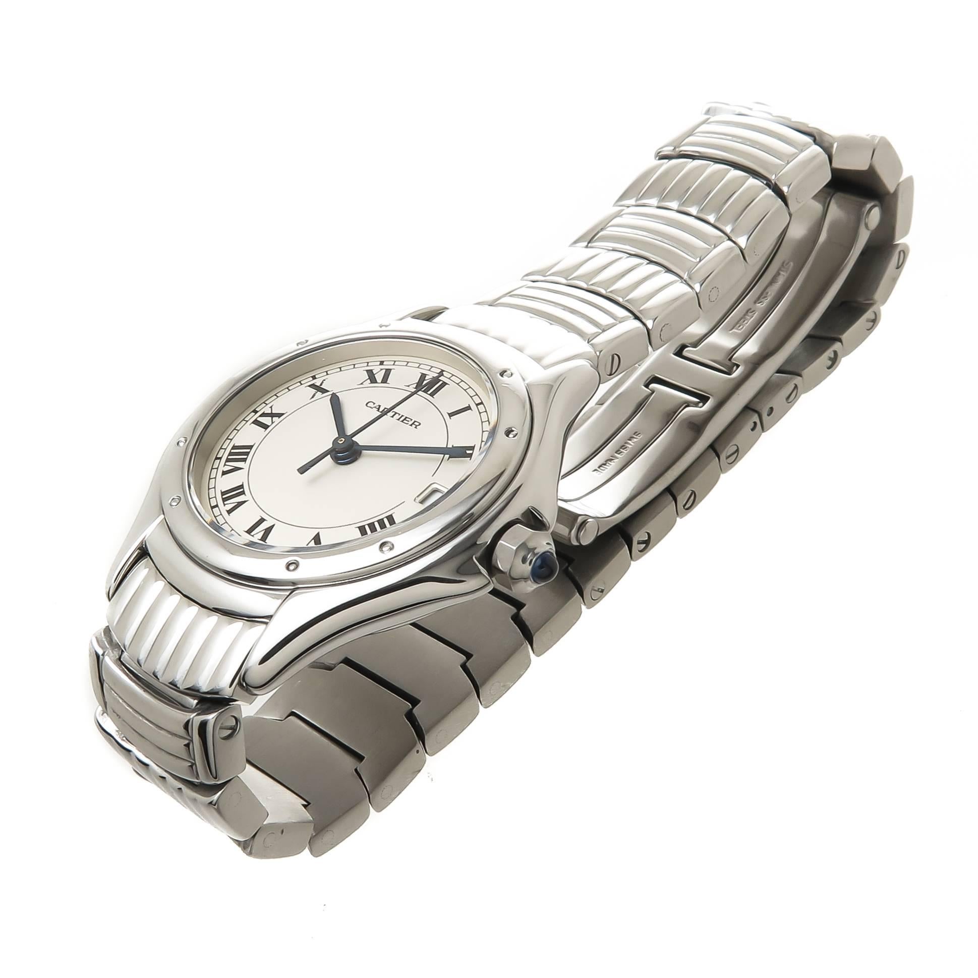 Circa 2005 Cartier Santos Ronde Collection ladies wrist watch, 26 MM Stainless Steel water resistant Case, Quartz Movement, Silvered Dial with Black Roman numerals, sweep seconds hand,  Calendar window at the 3 position and a sapphire Crown. 1/2