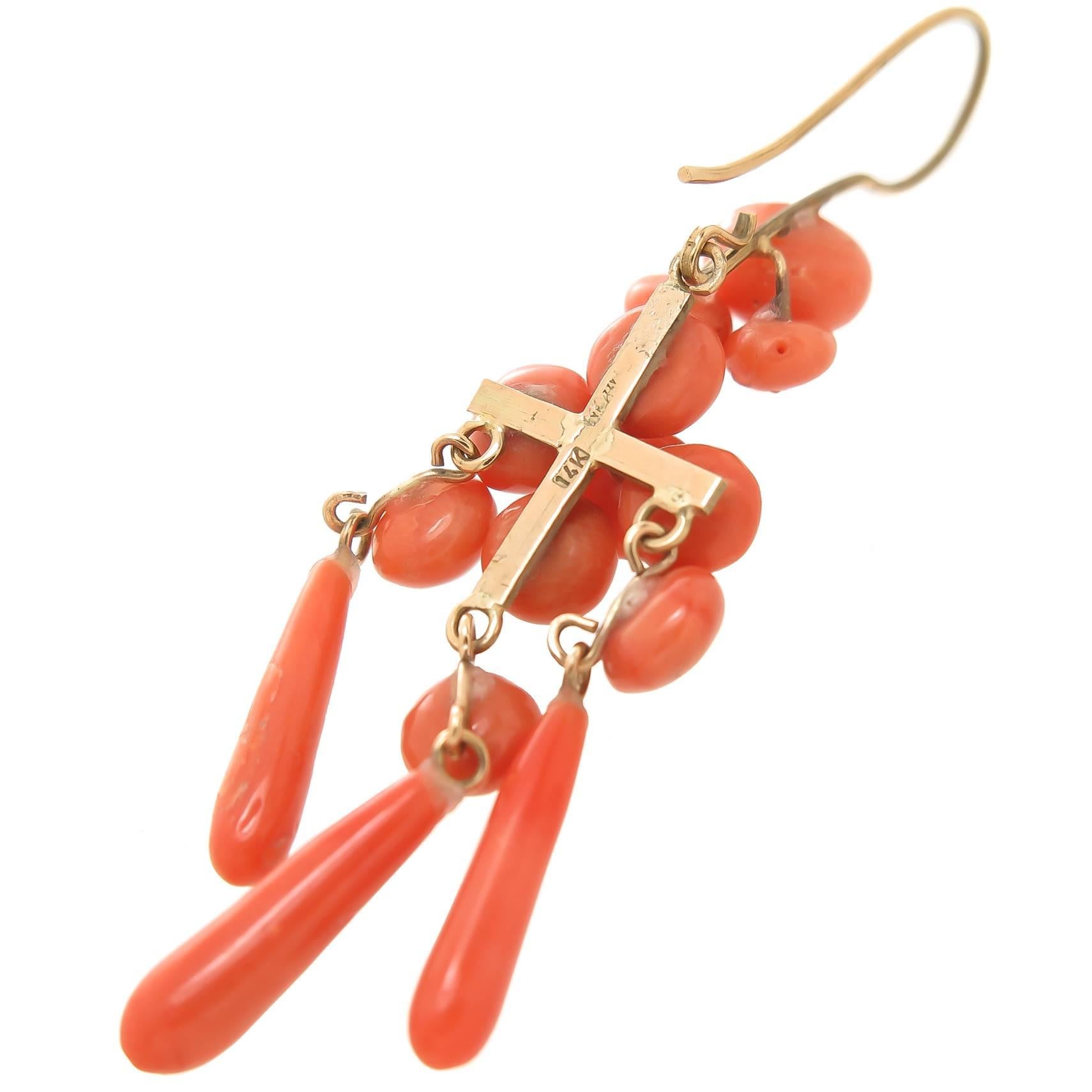 Circa 1900 14K Yellow Gold and Coral long dangle Earrings. Measuring 2 1/2 inch in length and 5/8 inch wide. Very nice color Coral typical of most Victorian jewelry of this time period. excellent Condition. 